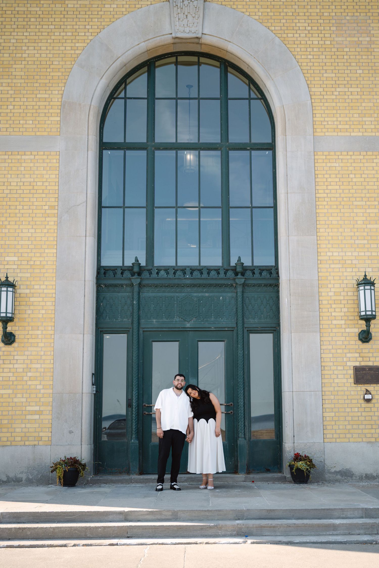 Candid engagement photo of a couple at RC Harris Treatment Plant, captured by a Toronto lifestyle and engagement photographer.