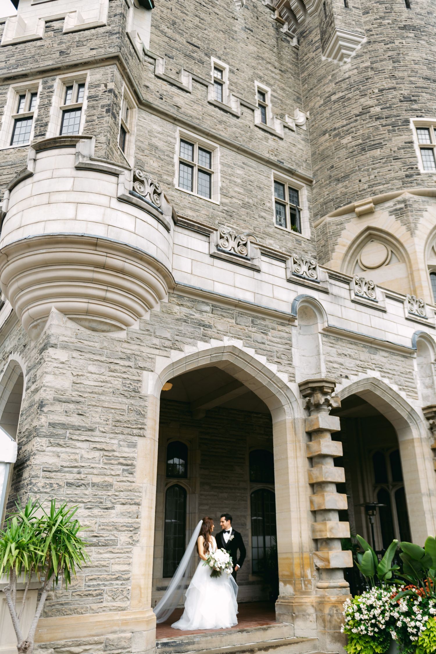 Portrait of a bride and groom at Casa Loma on their wedding day, photographed by a Toronto wedding photographer.