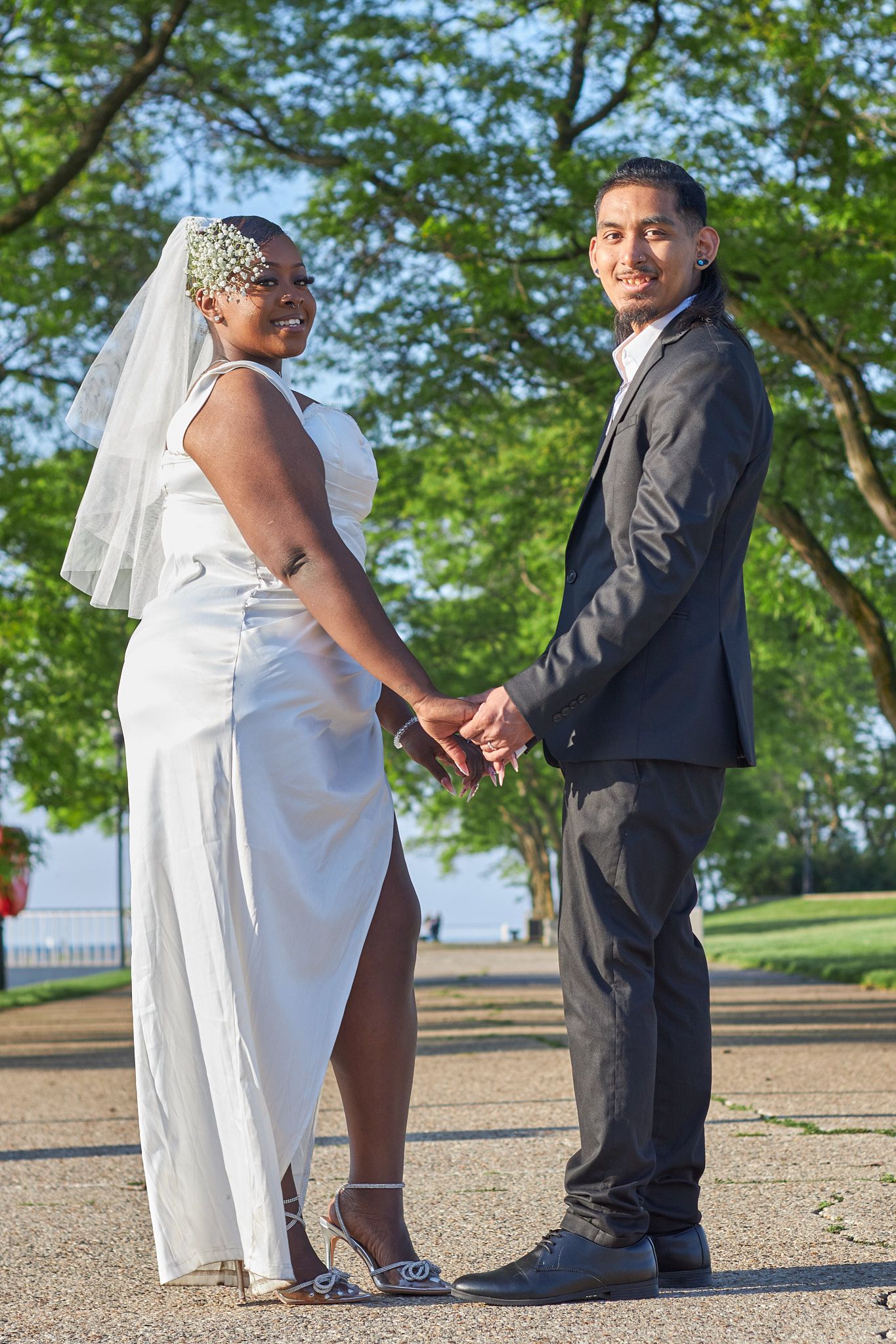 Married couple holding hands