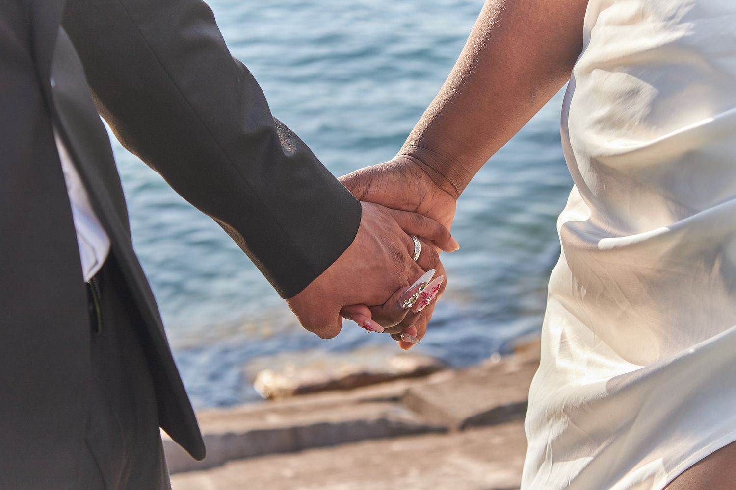 Married couple holding hands
