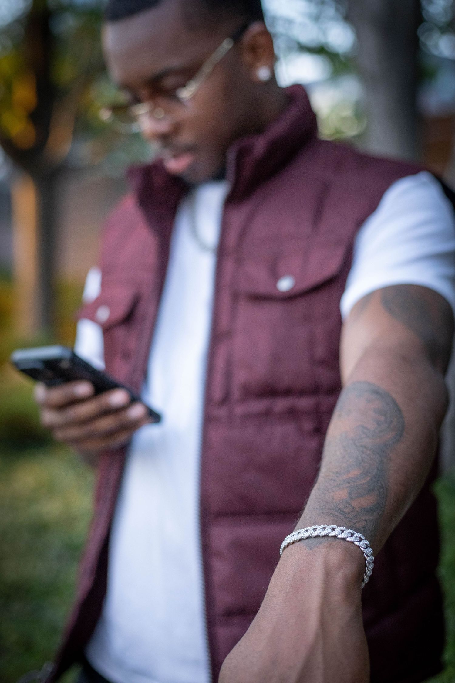 Black man showing off bracelet