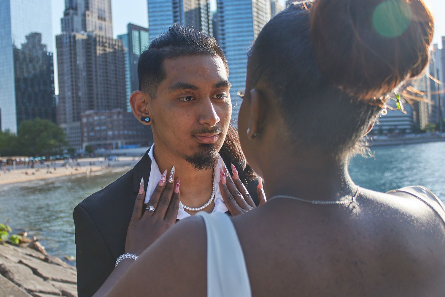 Bride fixing Groom's suit
