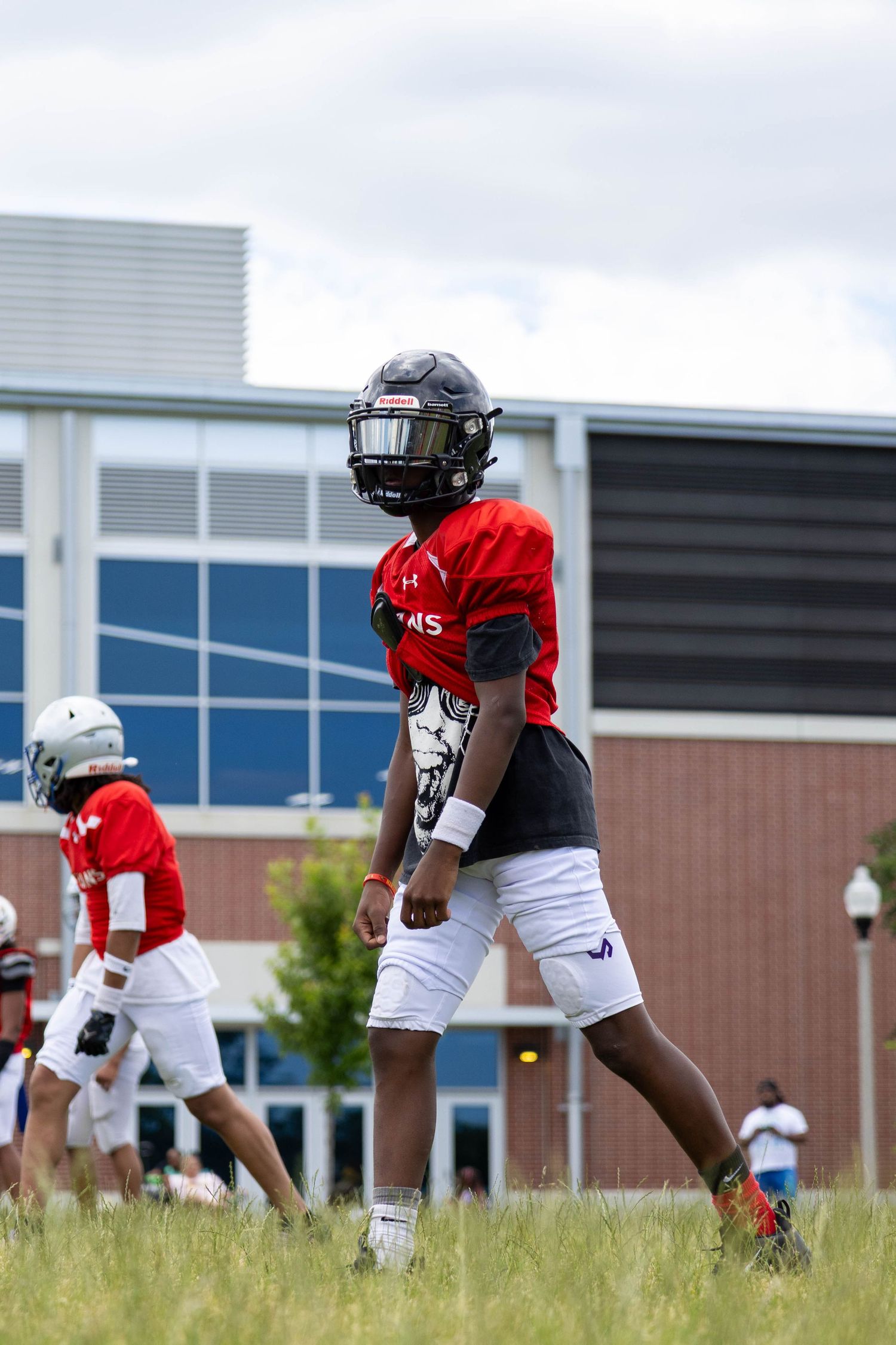 Football WR lining up at line of scrimmage