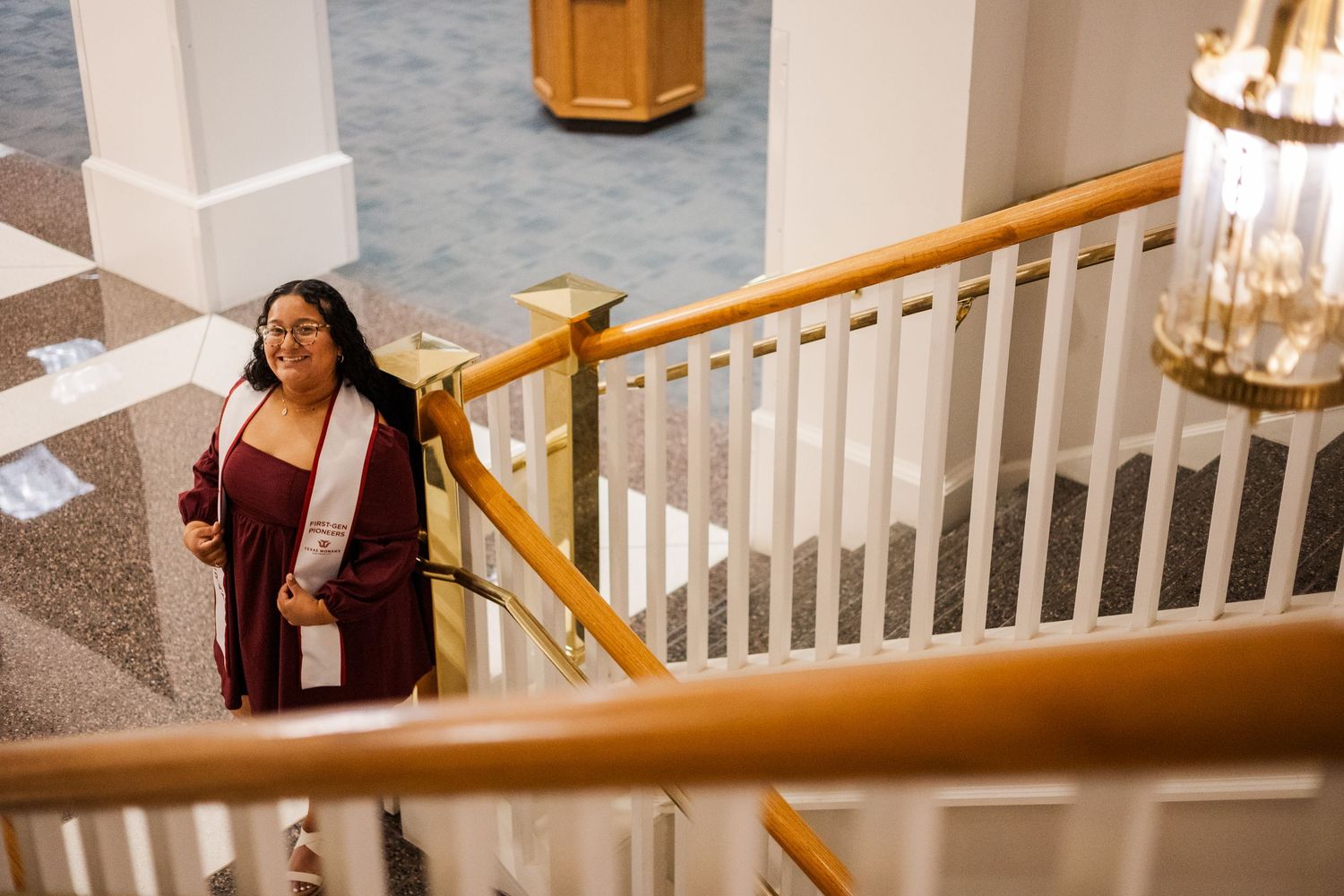 Senior photos at TWU library stairway.