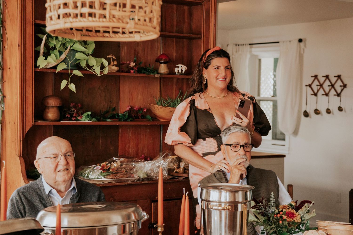Family overlooks as the couple perform their vows to each other during an intimate South Shore home wedding