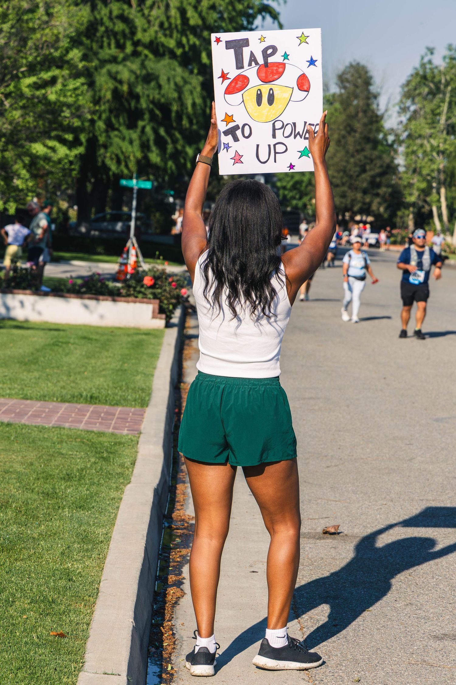 Woman cheering on race participants