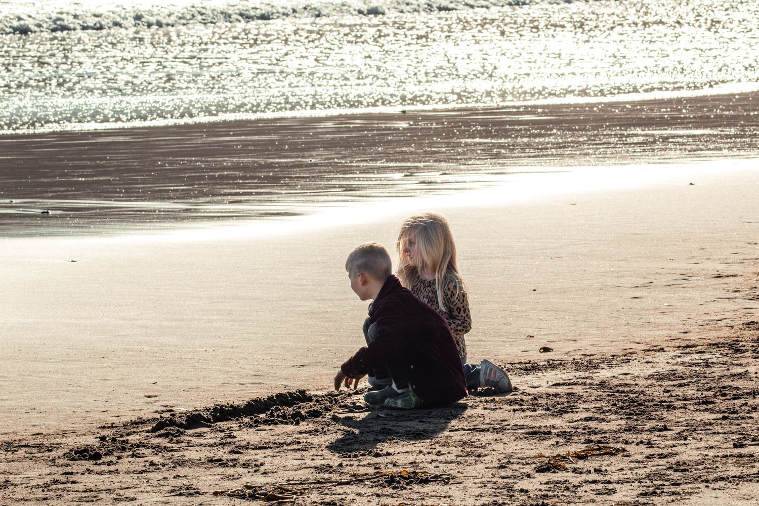 Children playing together on beach