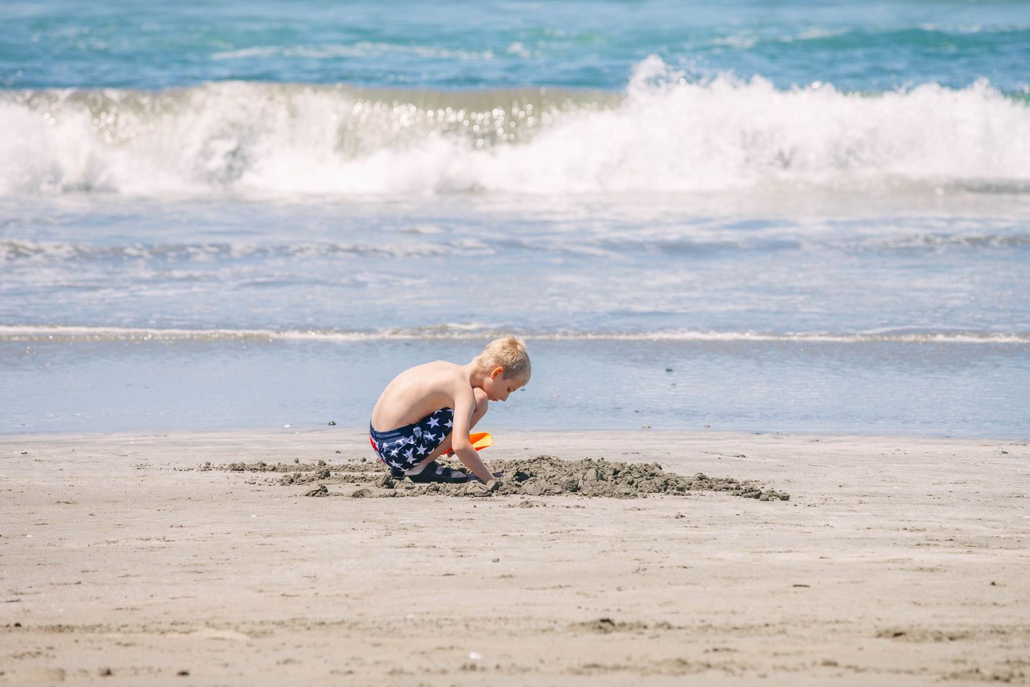 Boy playing at beach