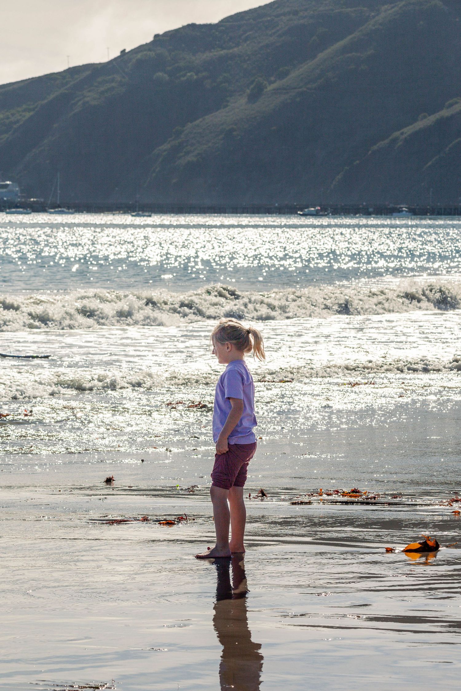 Young girl playing at the beach
