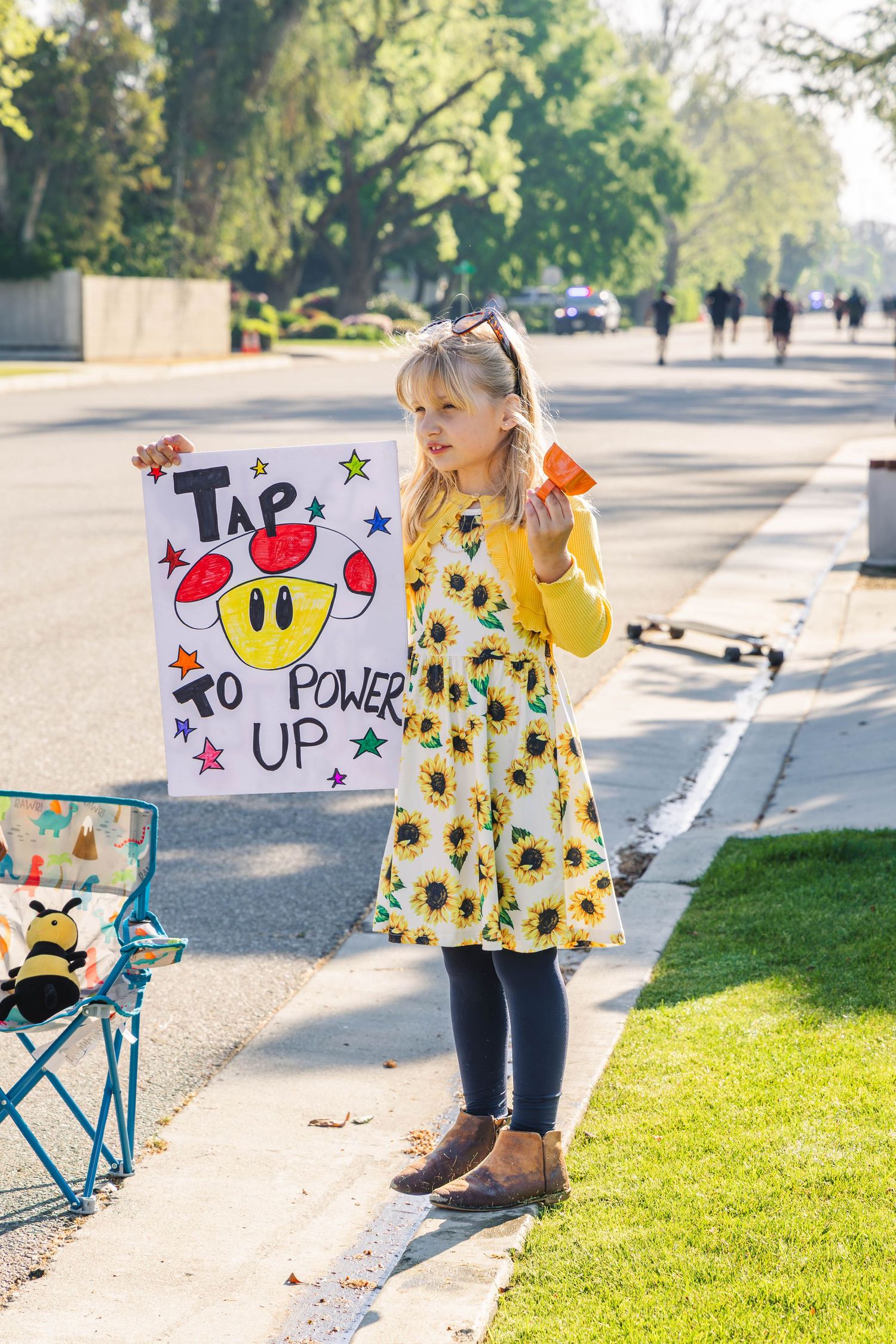 Young girl cheering on race participants