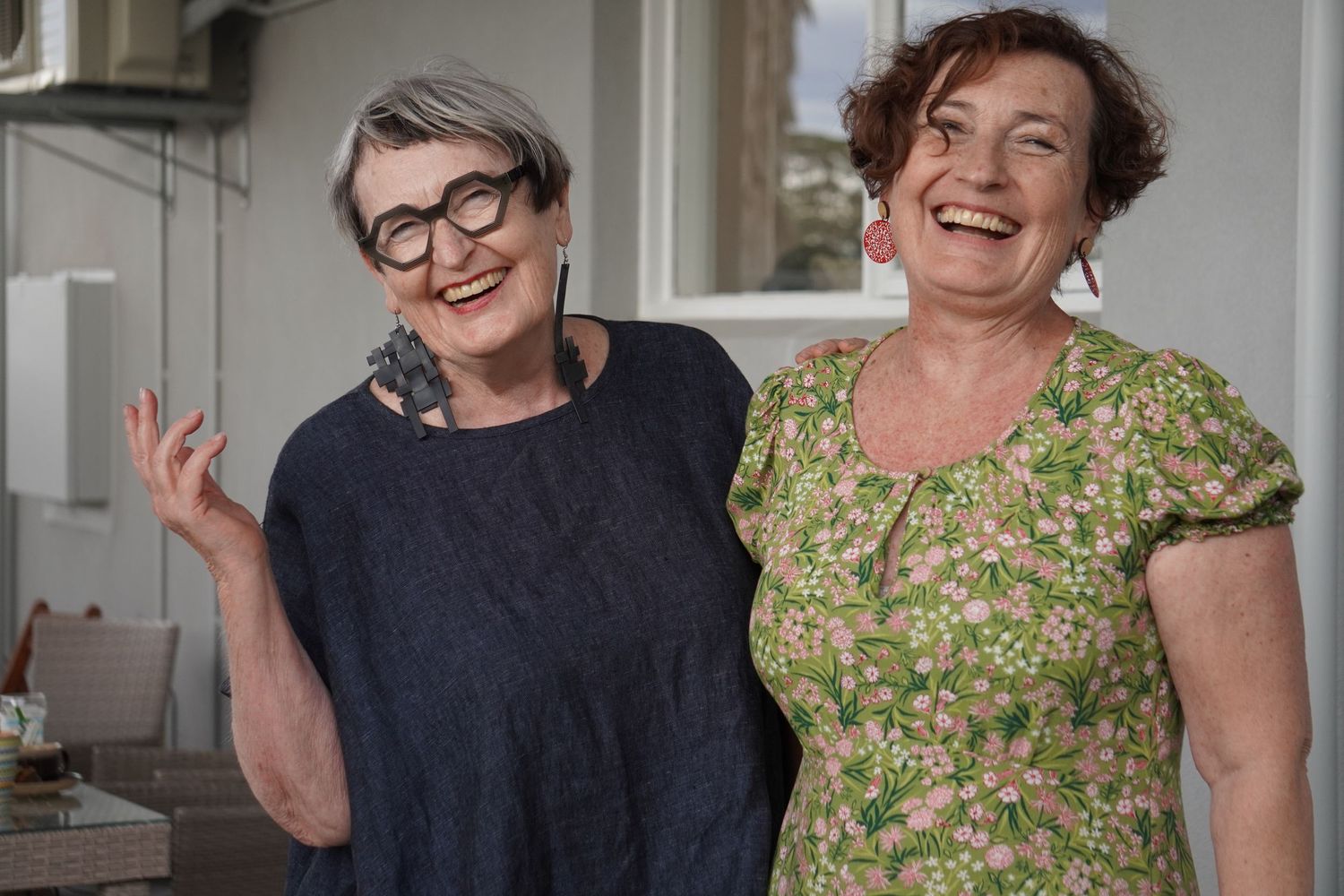 Two sisters smiling and laughing