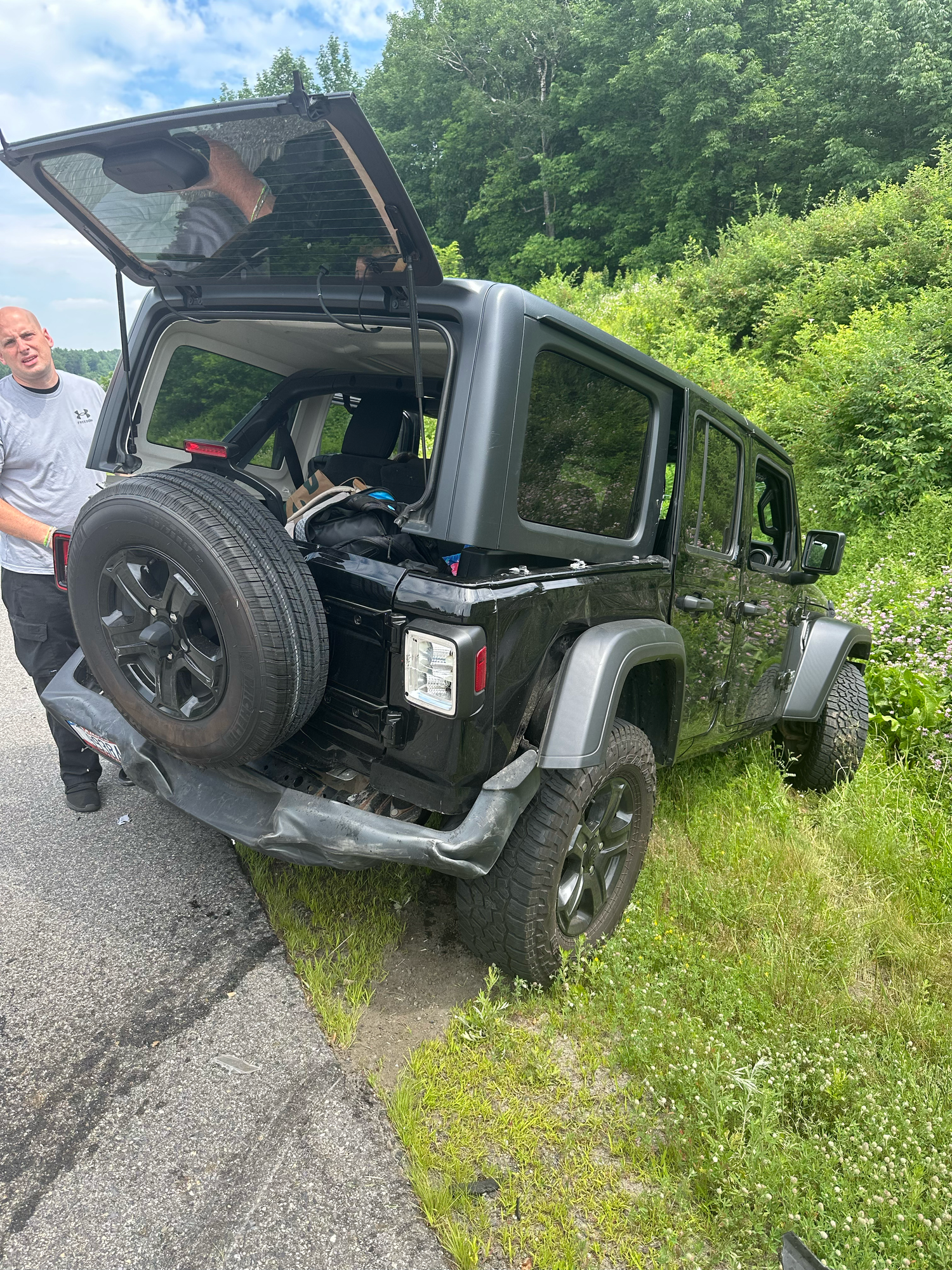 A series of photos showing a Jeep vehicle being repaired on the side of a grassy road.