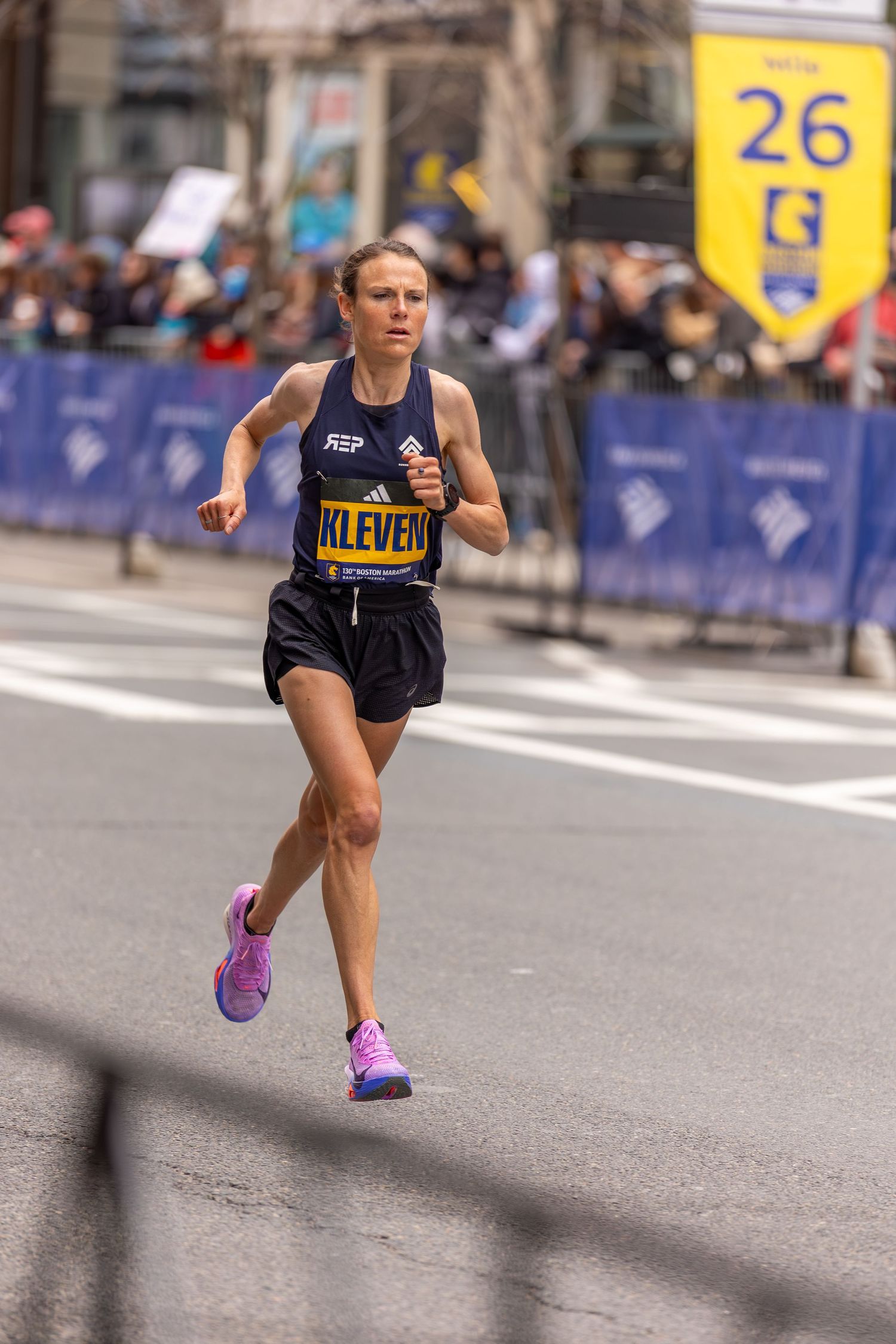 Runner Kleven races near mile 26 of the Boston Marathon in Adidas kit.