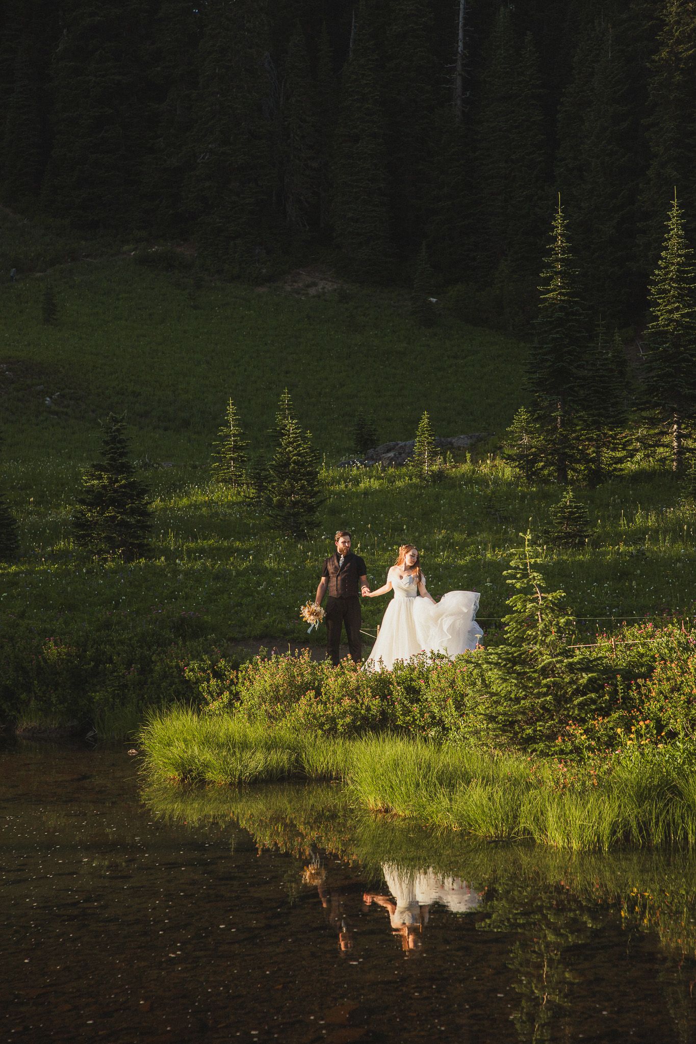elopement photos at Tipsoo Lake in Mount Rainier National Park during golden hour, Seattle couple standing by the water