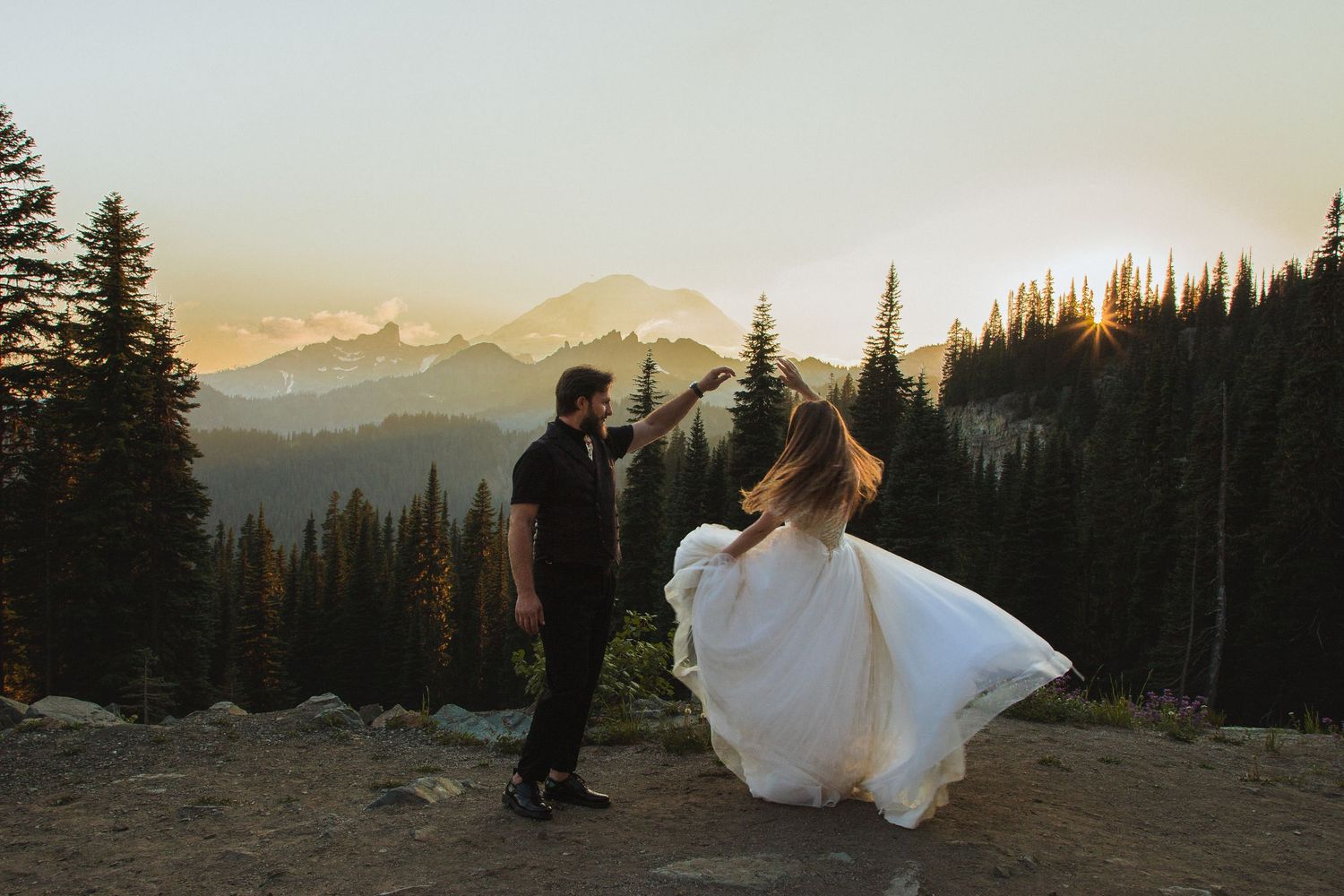Bride and groom dancing at sunset near Tipsoo Lake and Chinook Pass during a Mount Rainier elopement