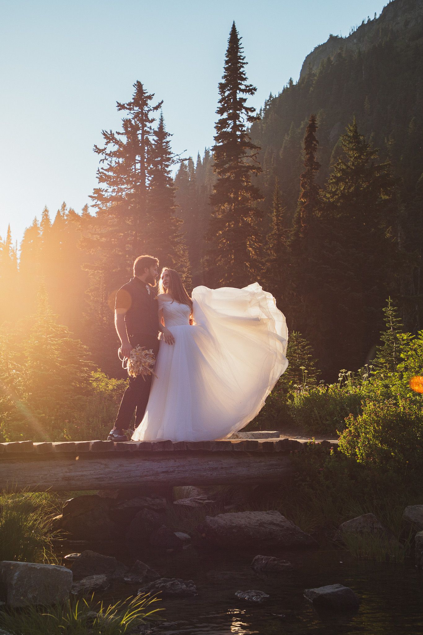 Golden hour elopement session at Tipsoo Lake, Seattle couple embracing with alpine lake and mountain scenery
