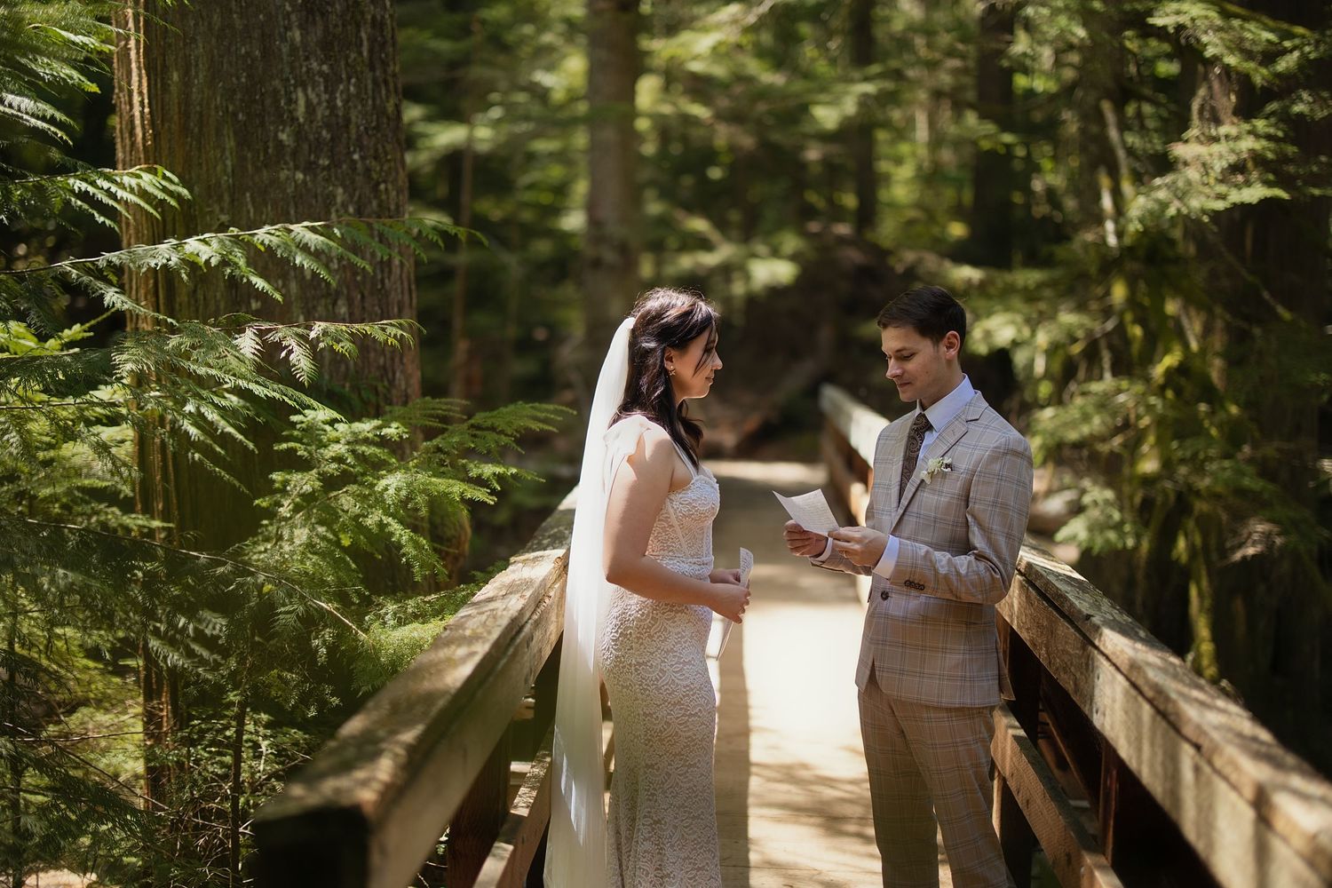 Private vow exchange on a forest bridge during an intimate elopement in Washington