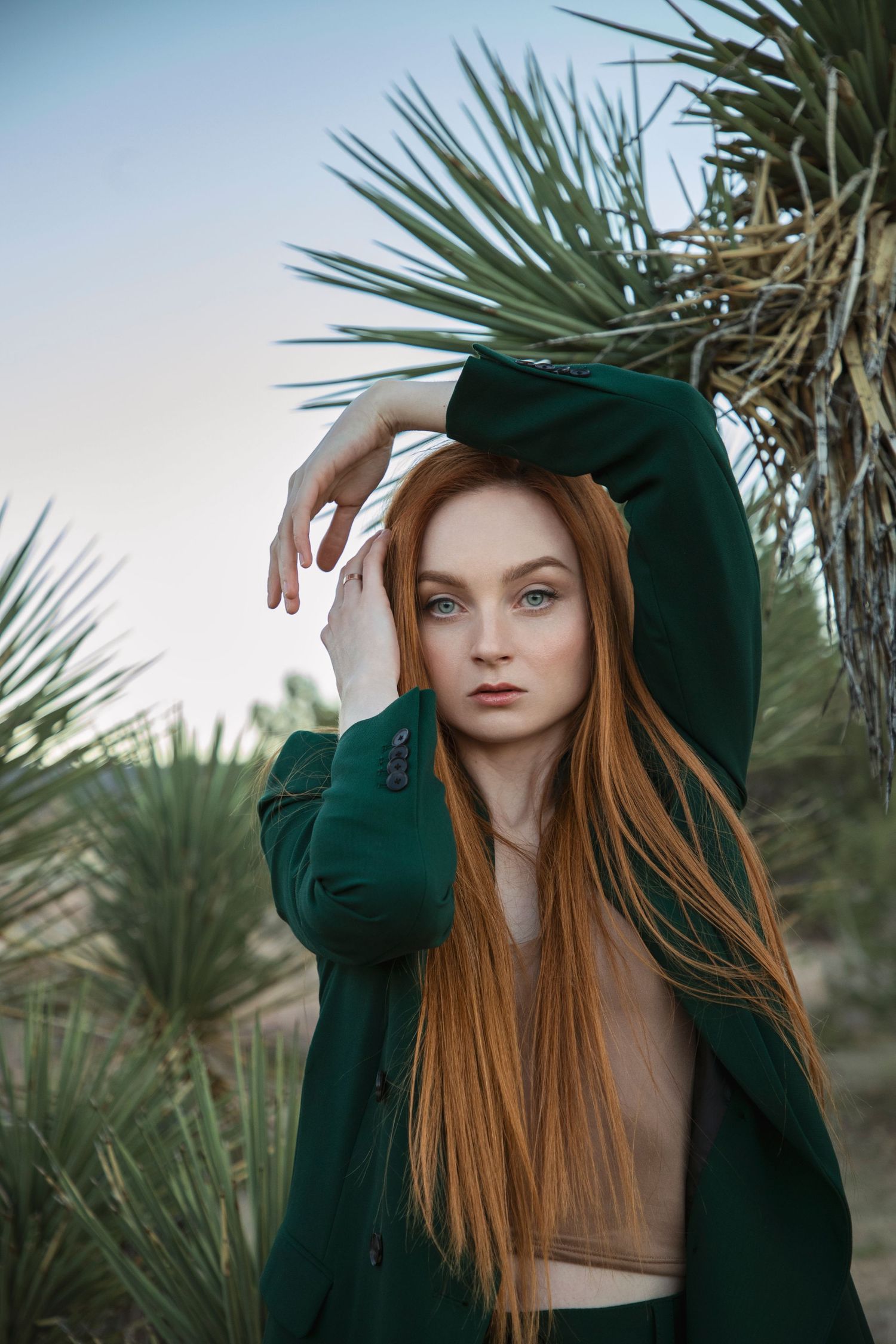 California desert portrait photoshoot with a woman among Joshua trees