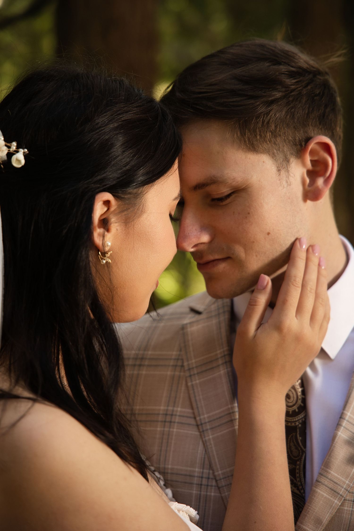 Close-up portrait of a newlywed couple during an intimate forest elopement in Washington State