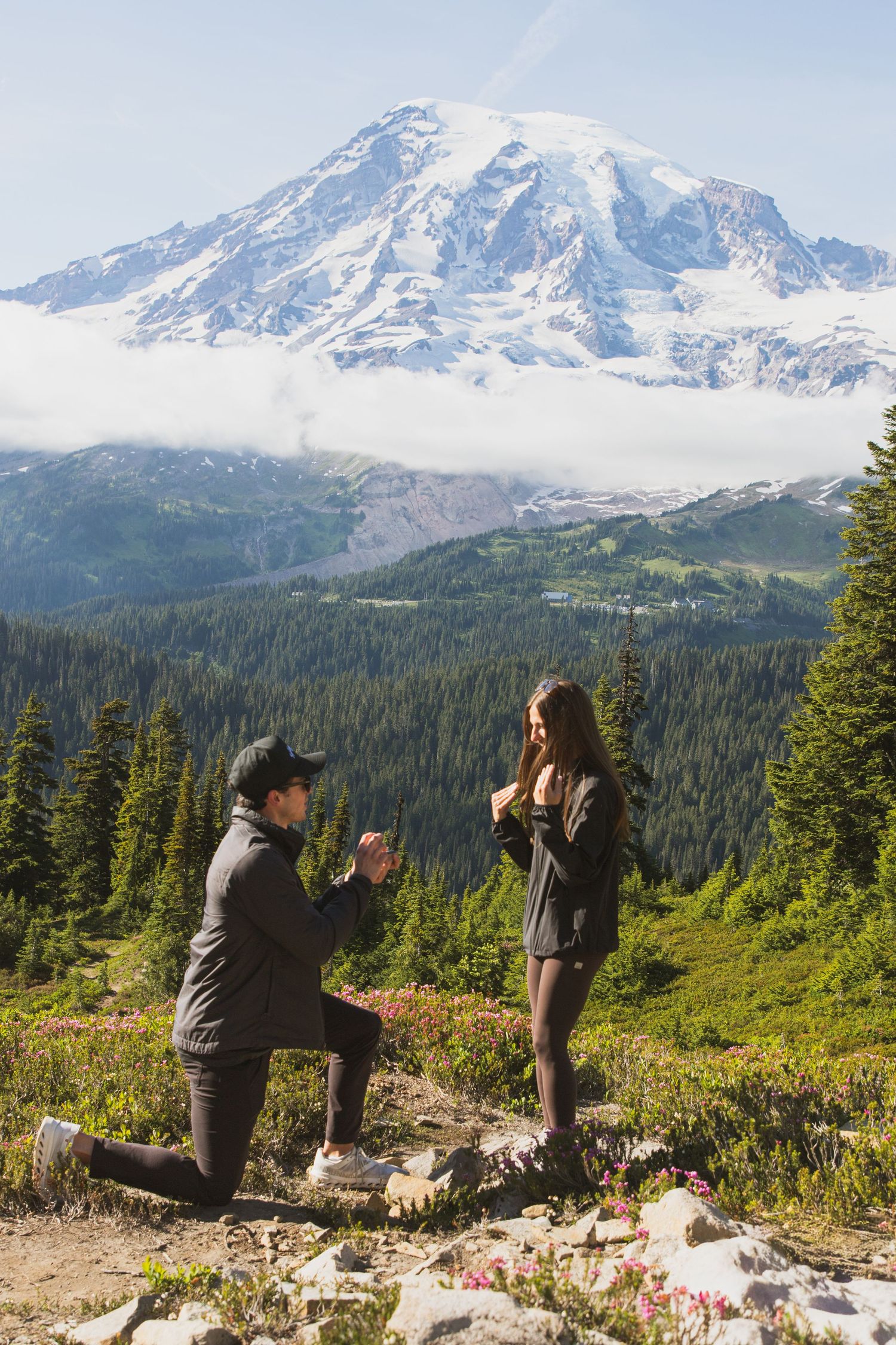 Surprise marriage proposal with Mount Rainier in the background at Mount Rainier National Park