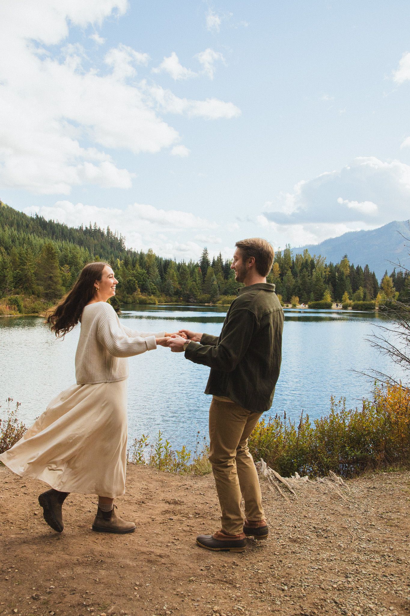 Couple photoshoot at Gold Creek Pond near Snoqualmie Pass, Seattle couple dancing by the water