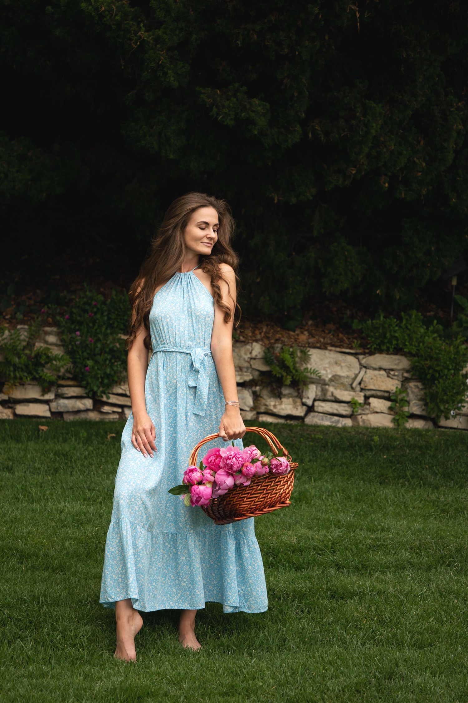 Seattle portrait photographer capturing a woman’s portrait session with peonies