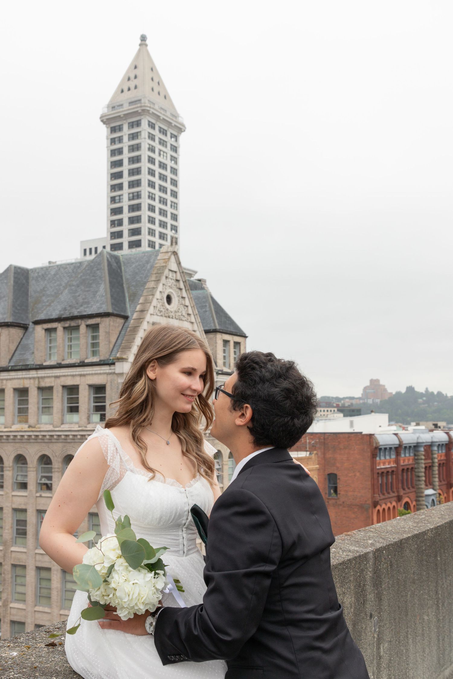 City elopement photoshoot in downtown Seattle, courthouse wedding followed by couple’s portraits on urban streets