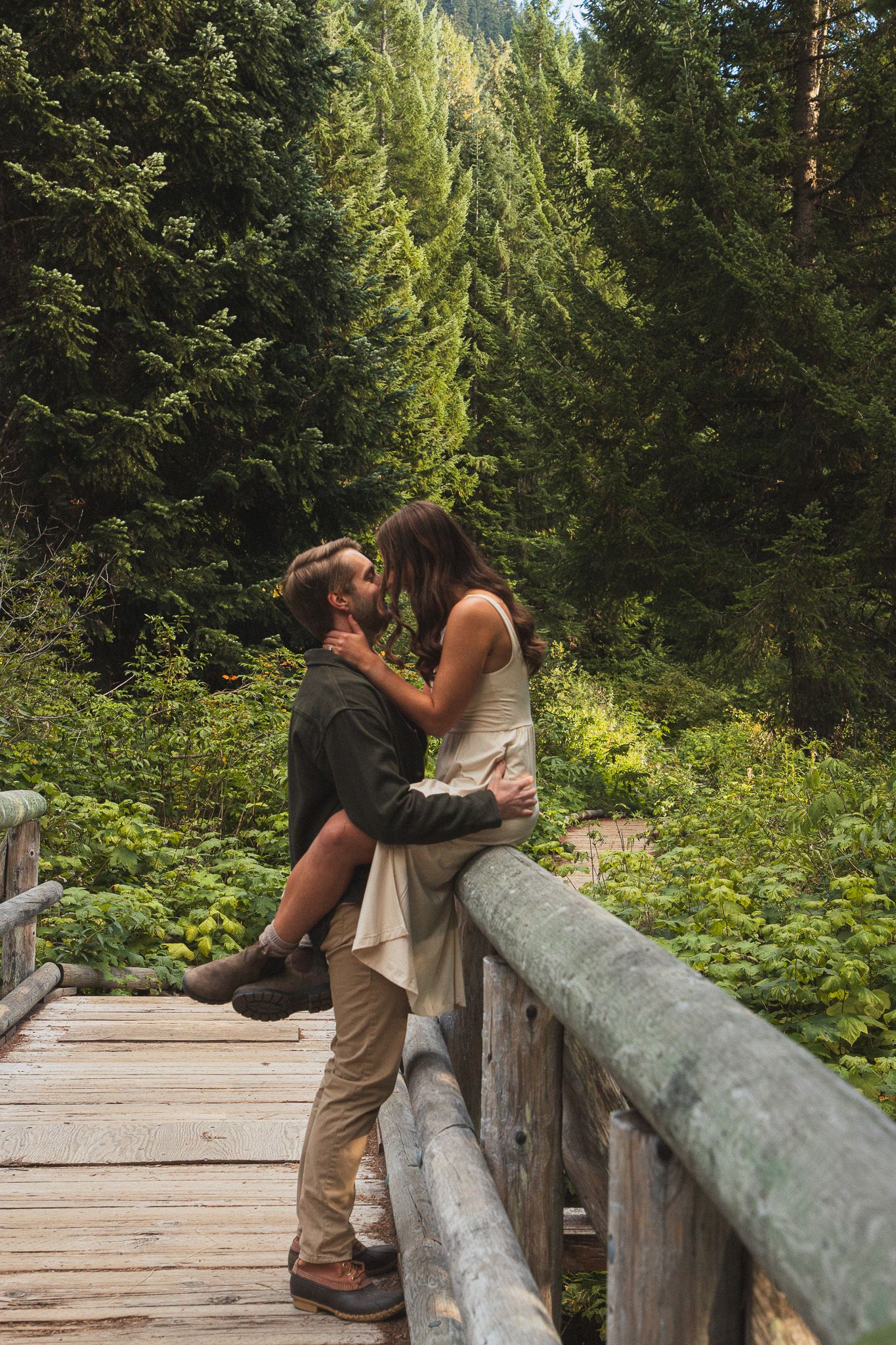old Creek Pond couple photoshoot in Washington, Seattle couple embracing with PNW scenery around them