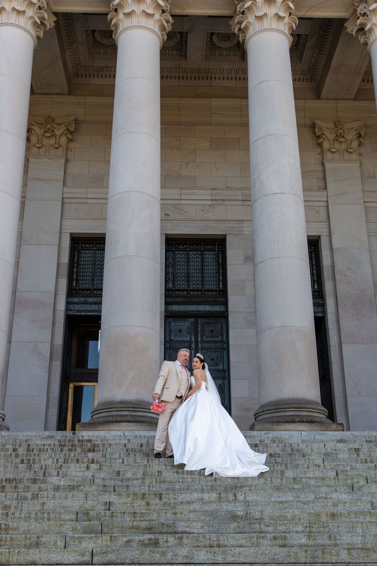 Seattle elopement photographer capturing an intimate wedding portrait at the Washington State Capitol in Olympia, elegant architectural back