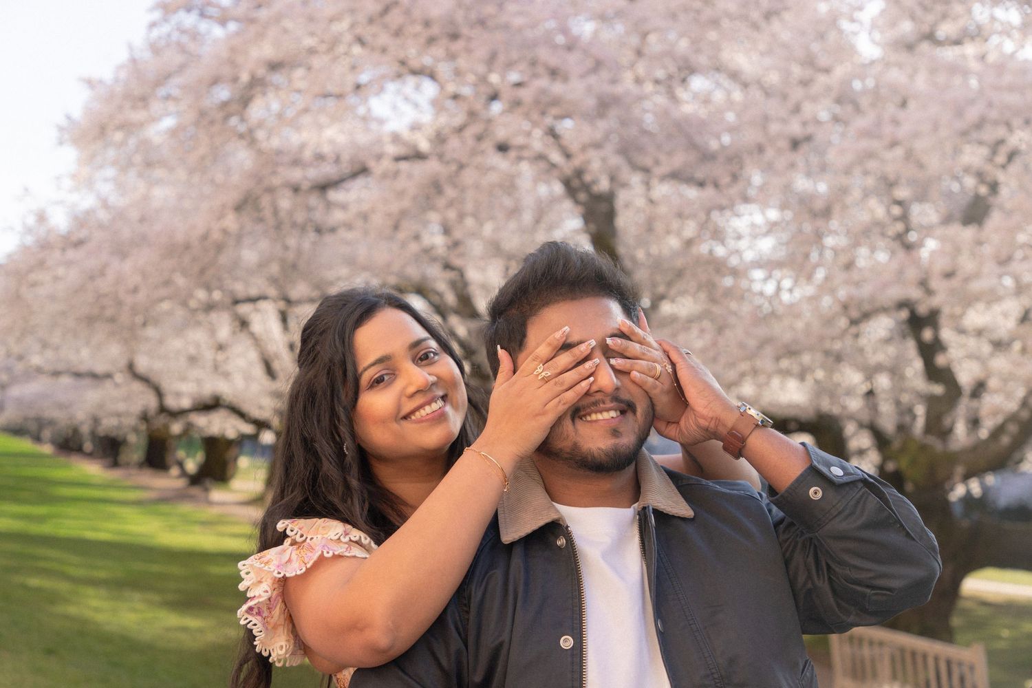 Spring couple photoshoot with cherry blossoms in full bloom at University of Washington, Seattle
