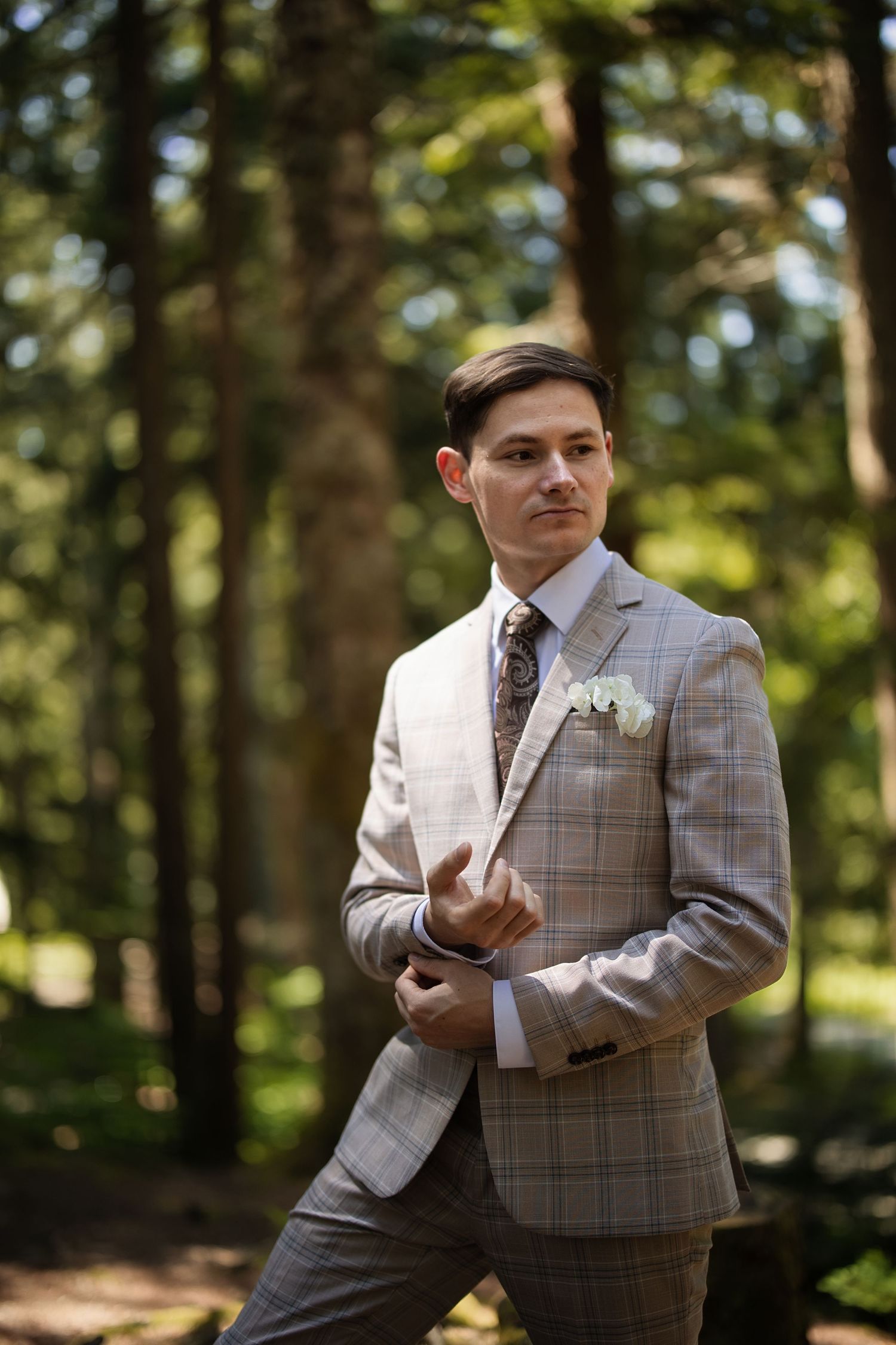 Groom portrait in a Pacific Northwest forest during an intimate wedding and elopement celebration