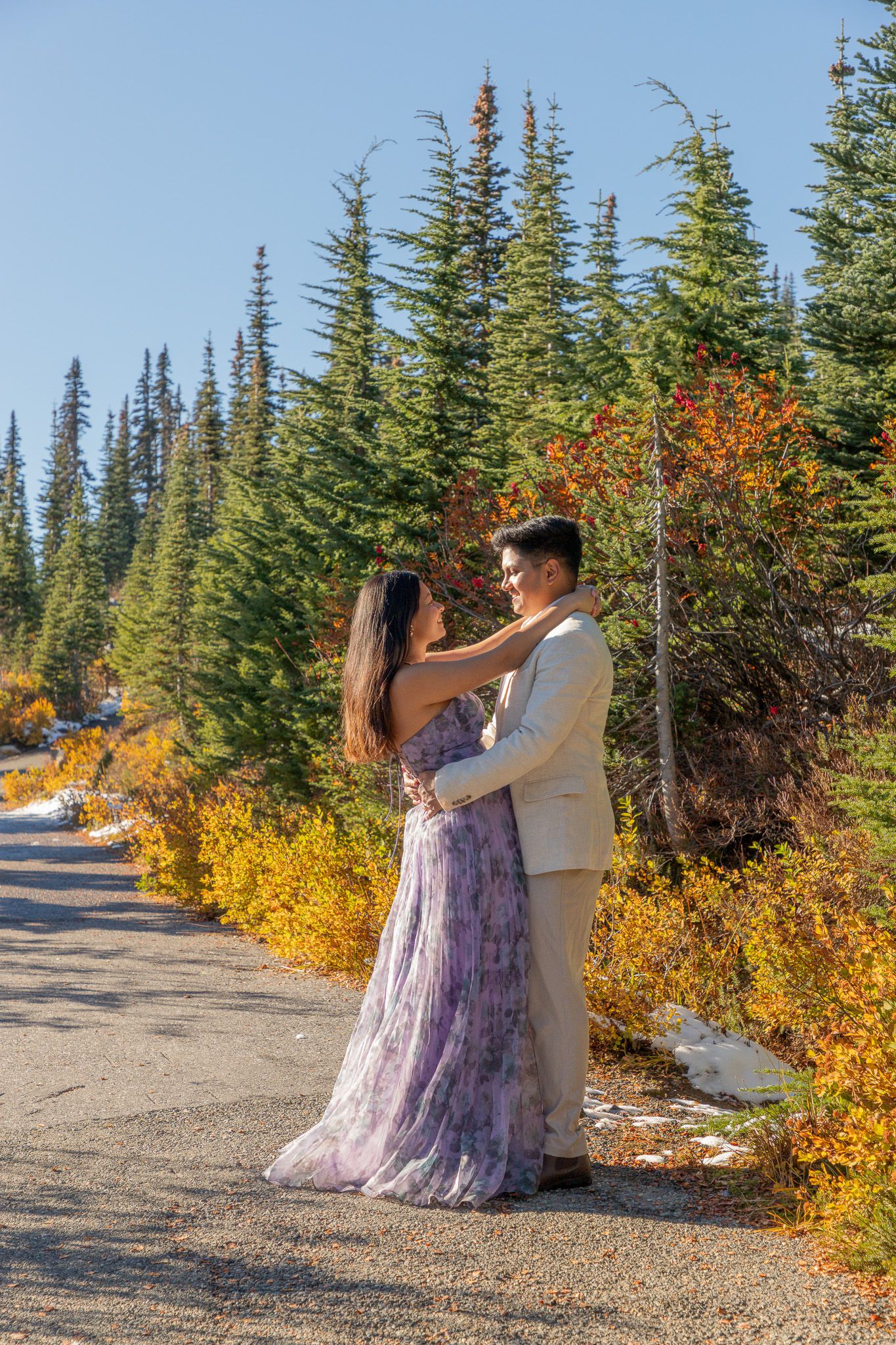 Seattle engagement photographer capturing an adventurous Mount Rainier engagement photoshoot on a mountain trail