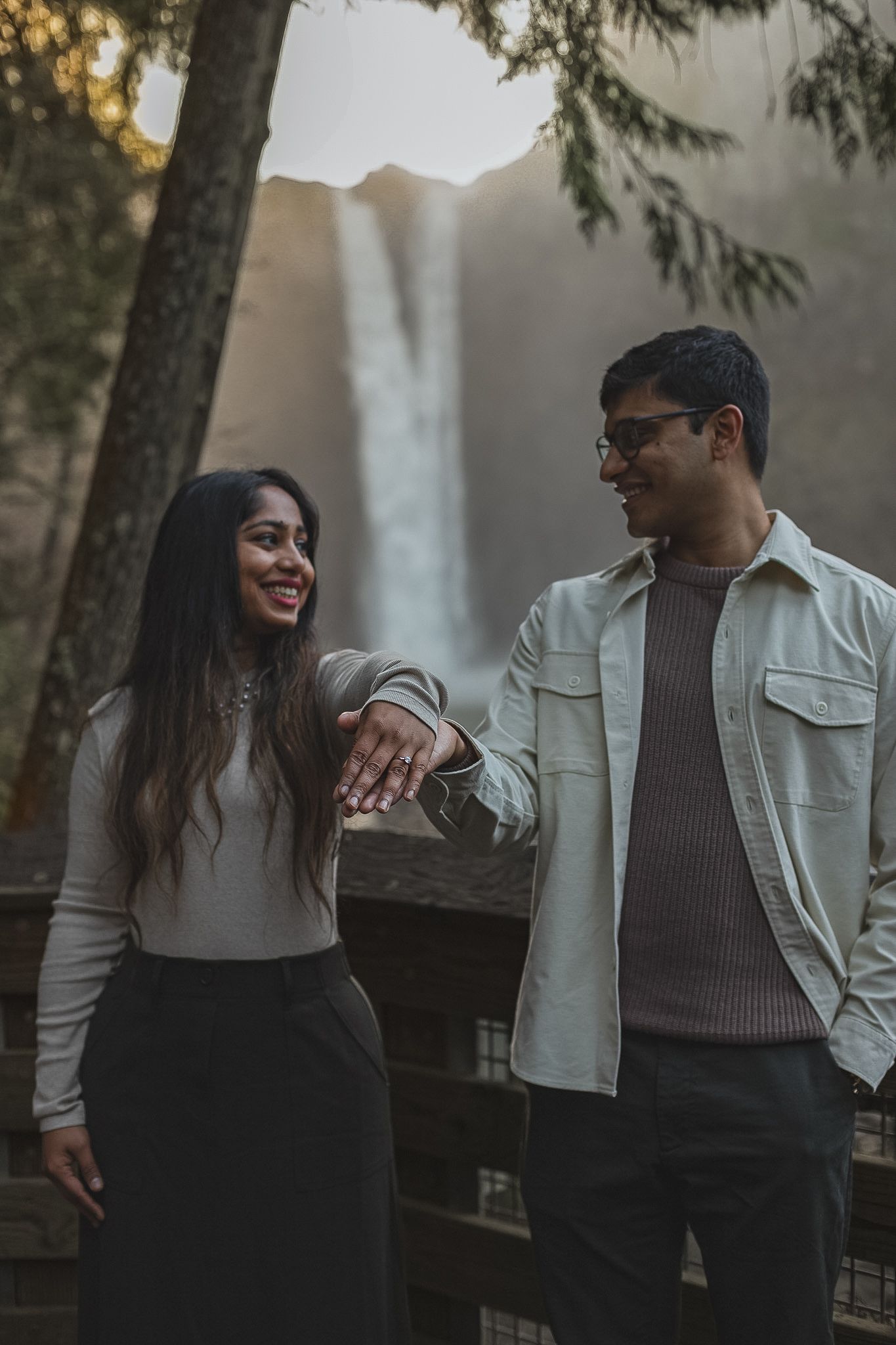 Proposal photoshoot at Snoqualmie Falls, Washington with waterfall backdrop