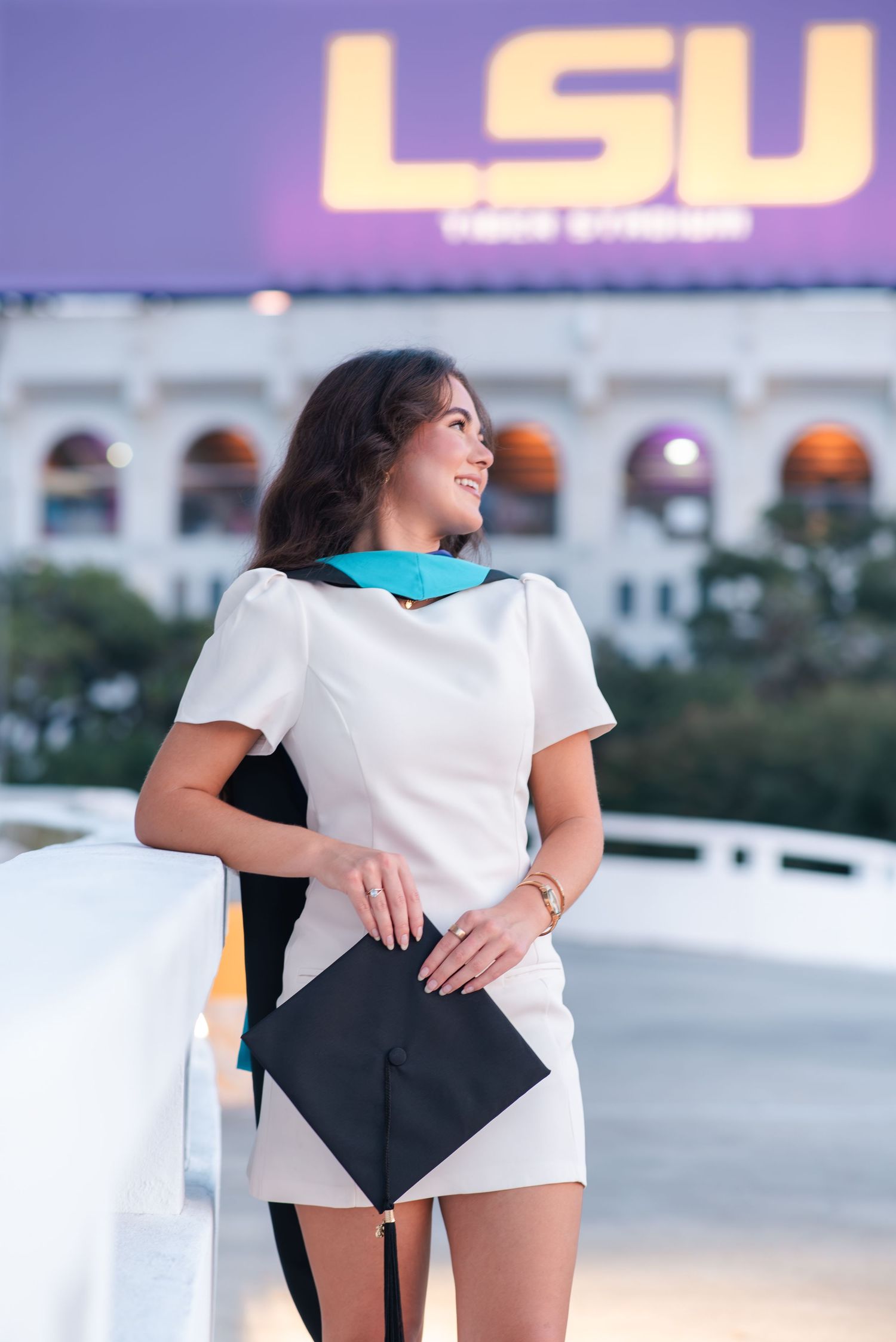 Louisiana State University graduate poses at LSU campus in Baton Rouge, Louisiana.