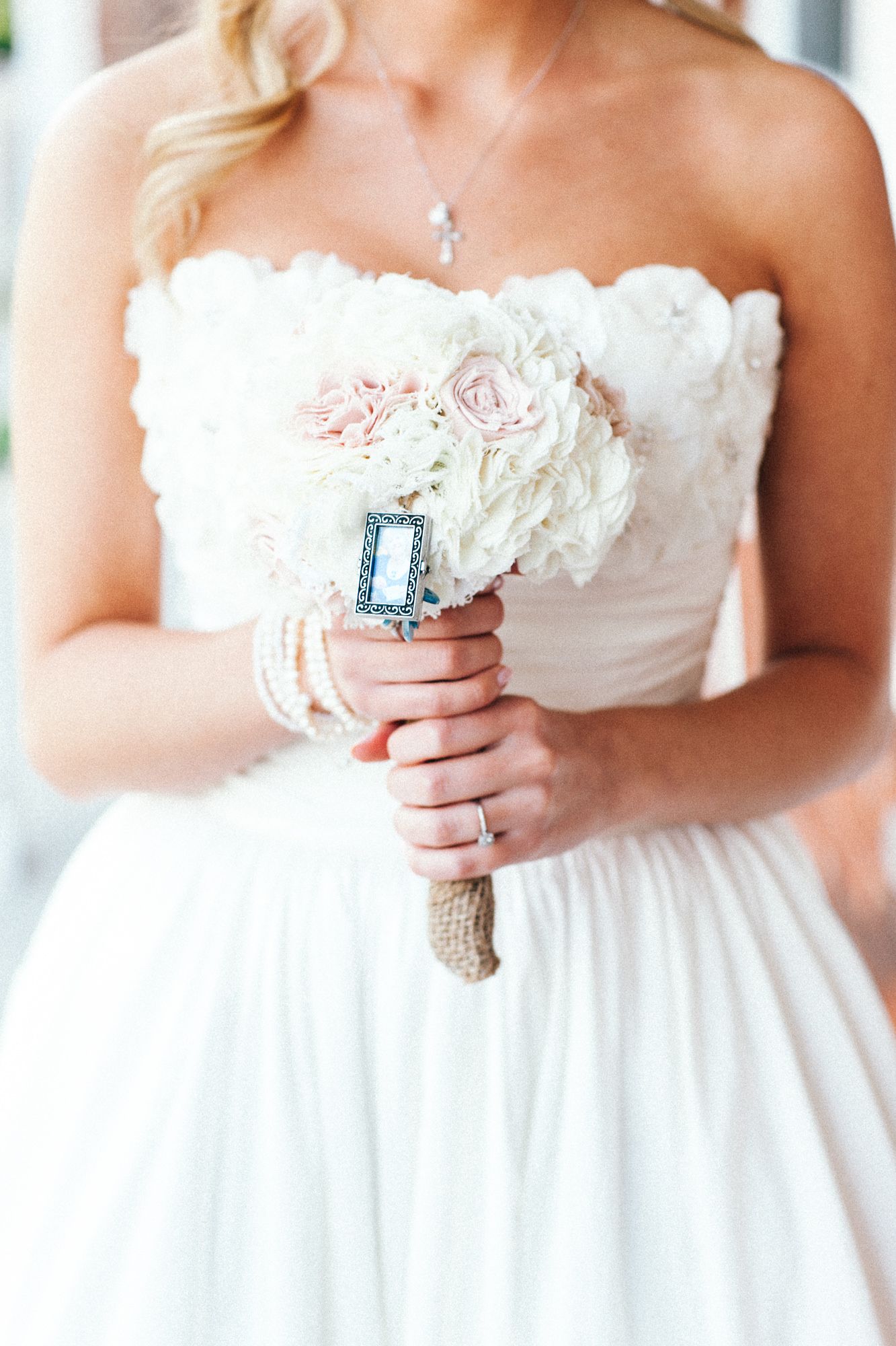Close-up shots of a bride holding a vintage-style bouquet in a white dress.