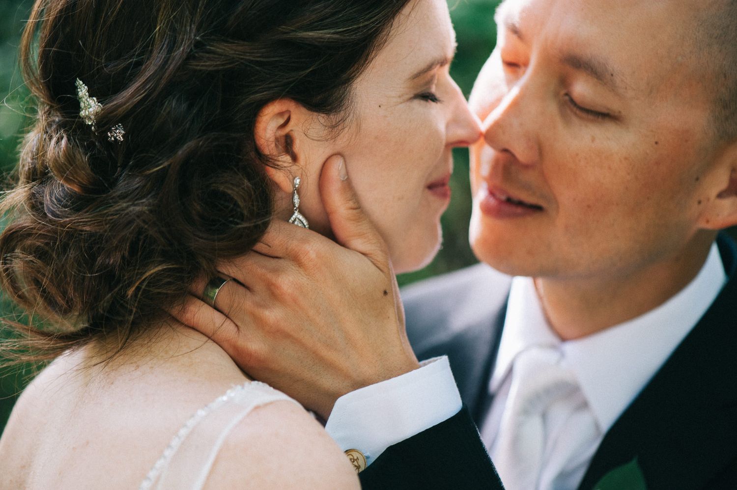Intimate close-up of a tender moment between newlyweds.