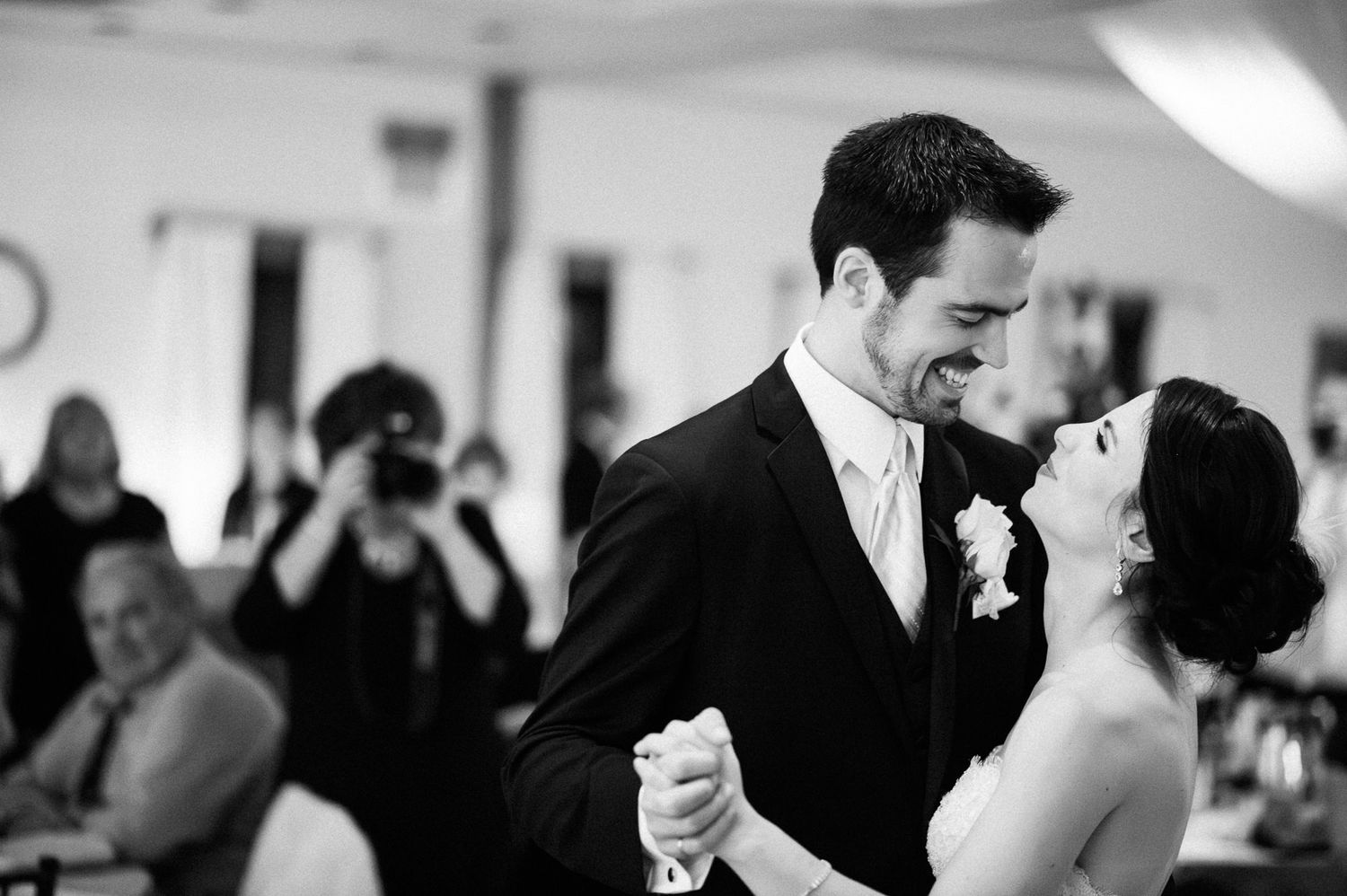 Wedding party dancing and celebrating at an elegant reception.