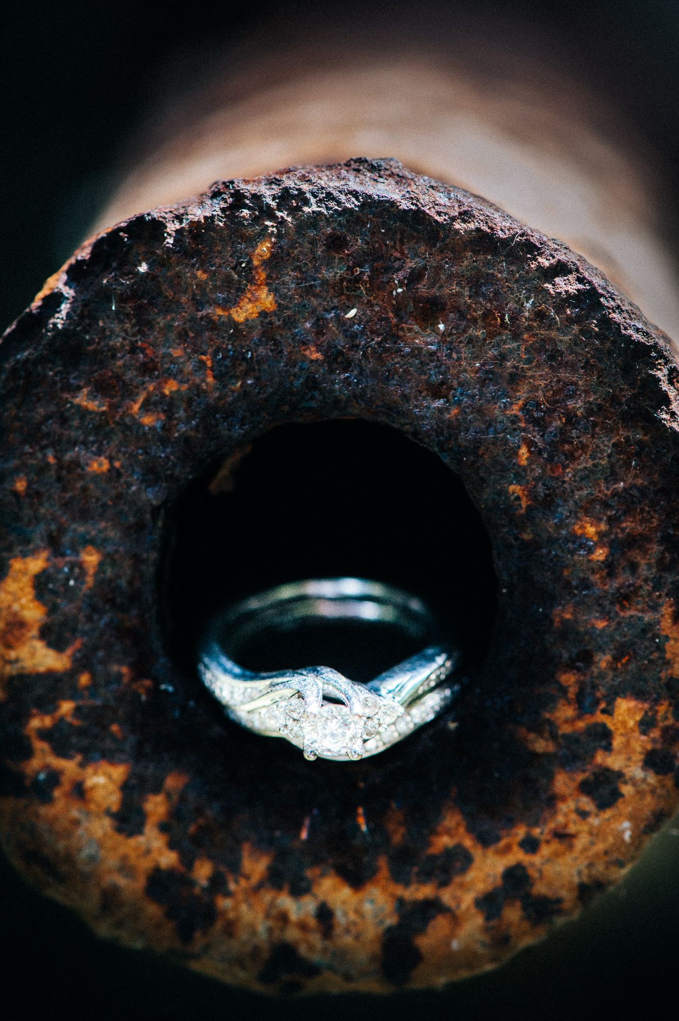 Close-up sequence of a rusty metal eye shape with contrasting blue and orange tones.
