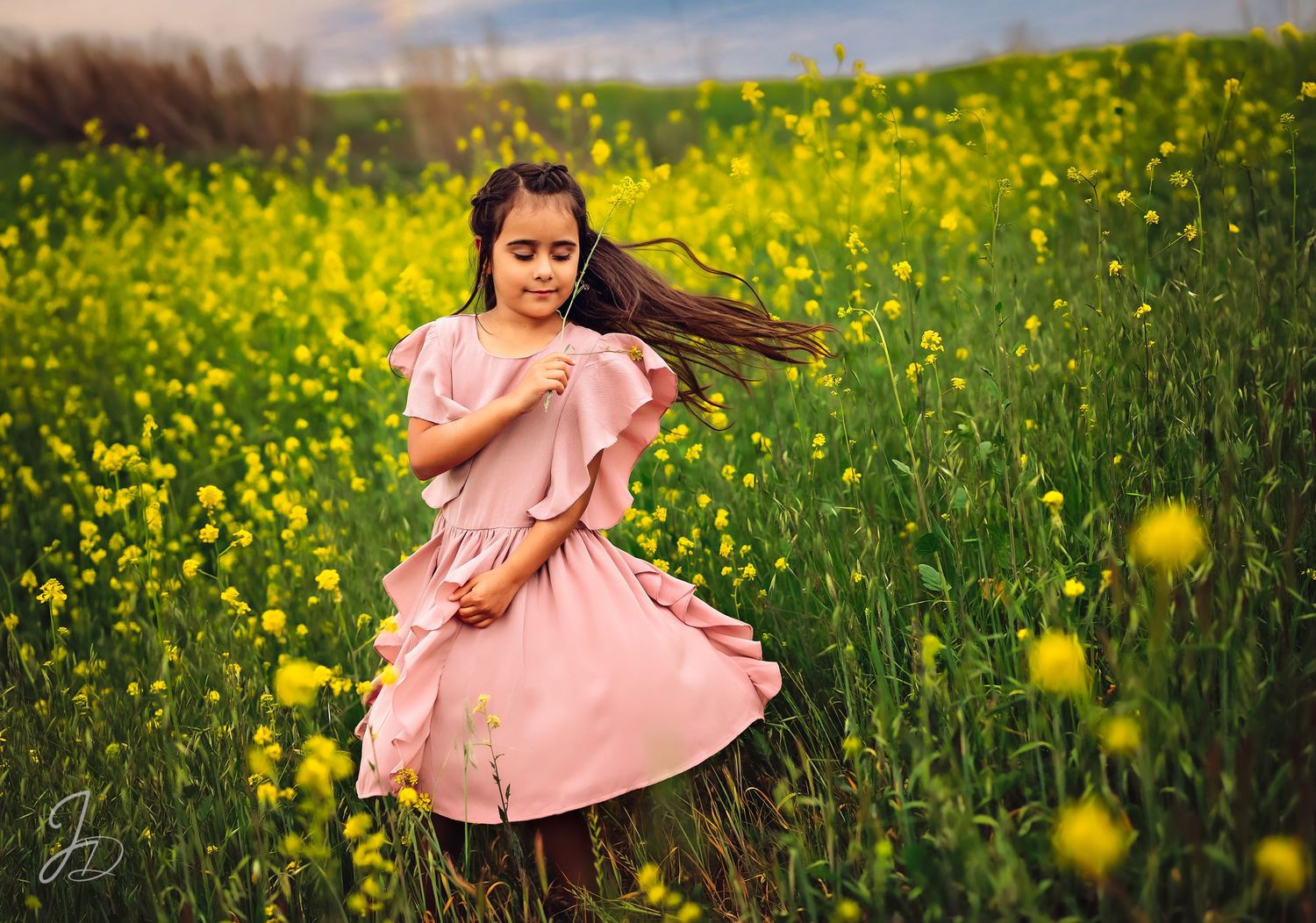 Joyful moments captured in field of yellow wildflowers during golden hour.