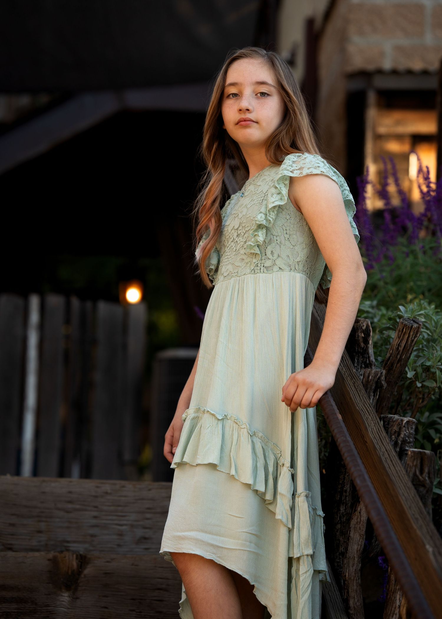 A mint green dress flows elegantly in a series of artistic outdoor portrait shots.