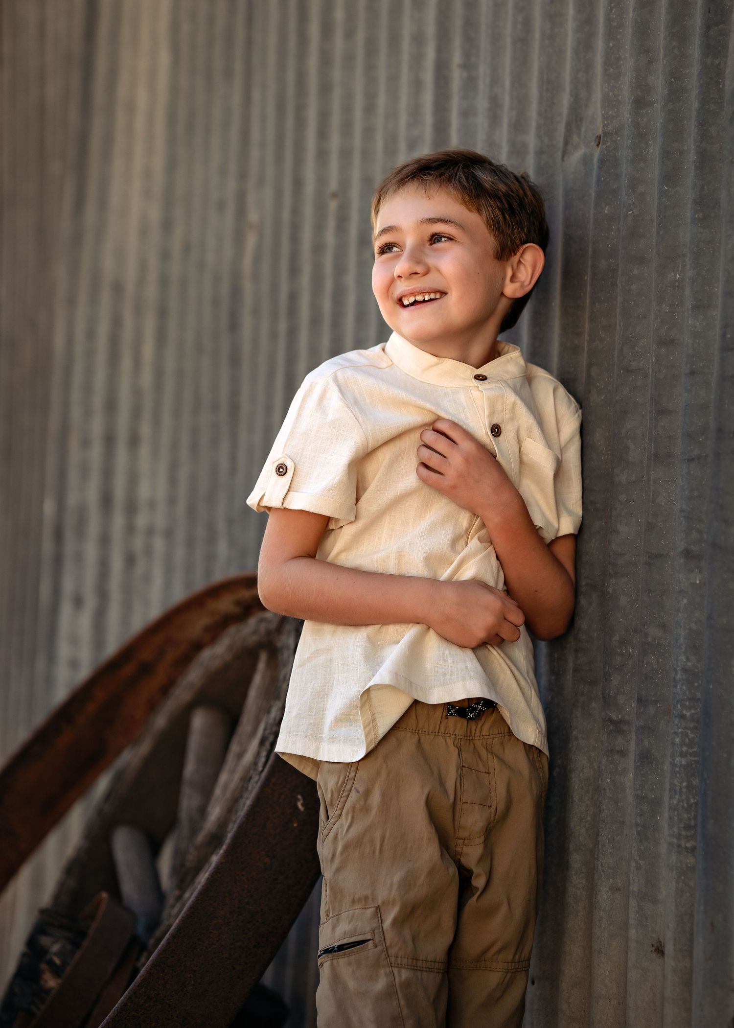 Series of playful expressions captured against industrial wall background.