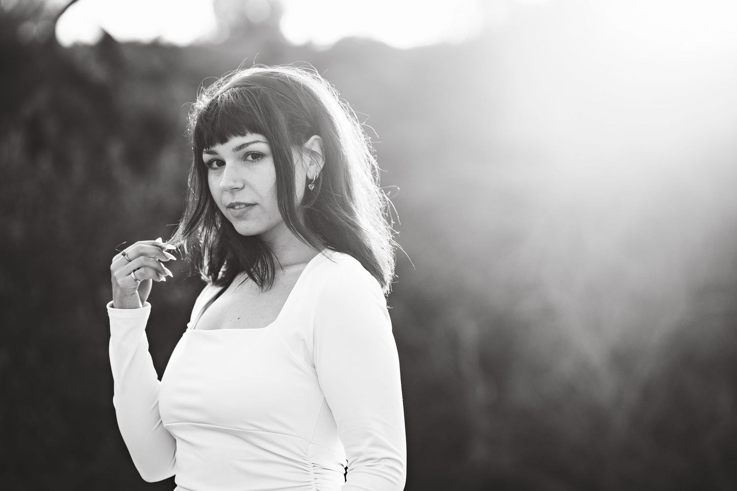 Black and white portrait series with dramatic lighting and shadows.