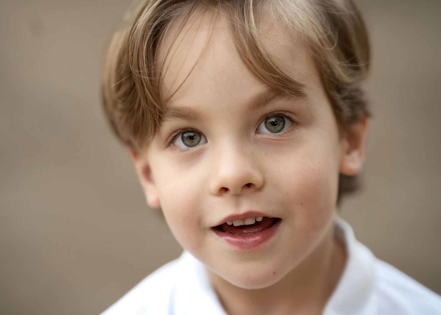 Close-up portrait series with soft neutral background.