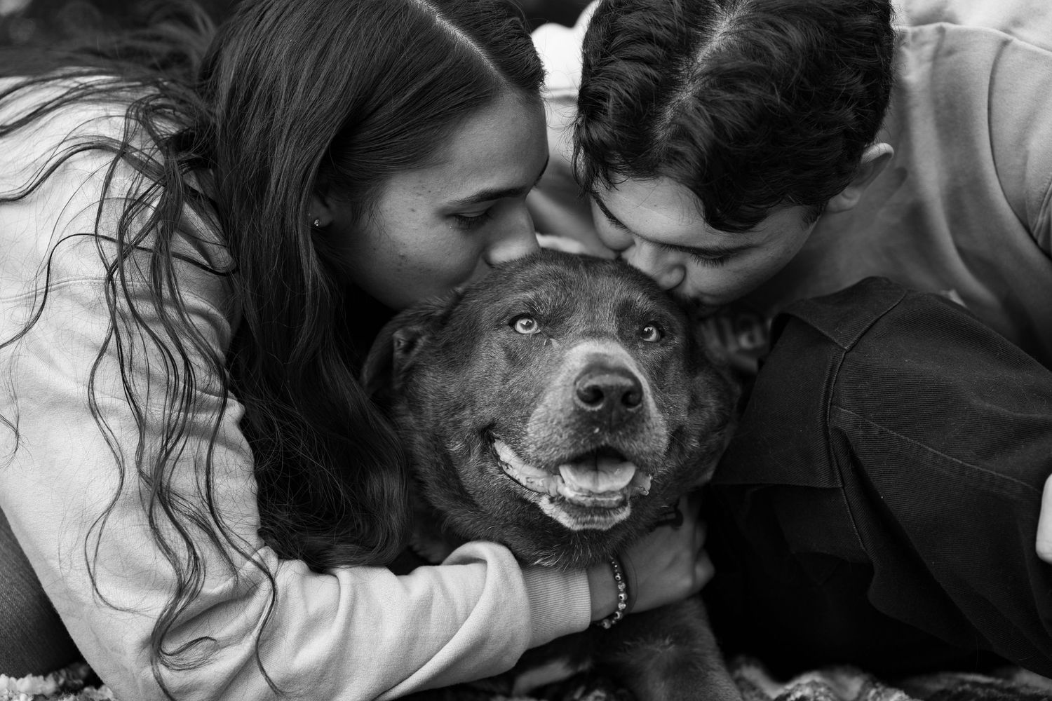 Black and white intimate portraits showing genuine laughter and joy.