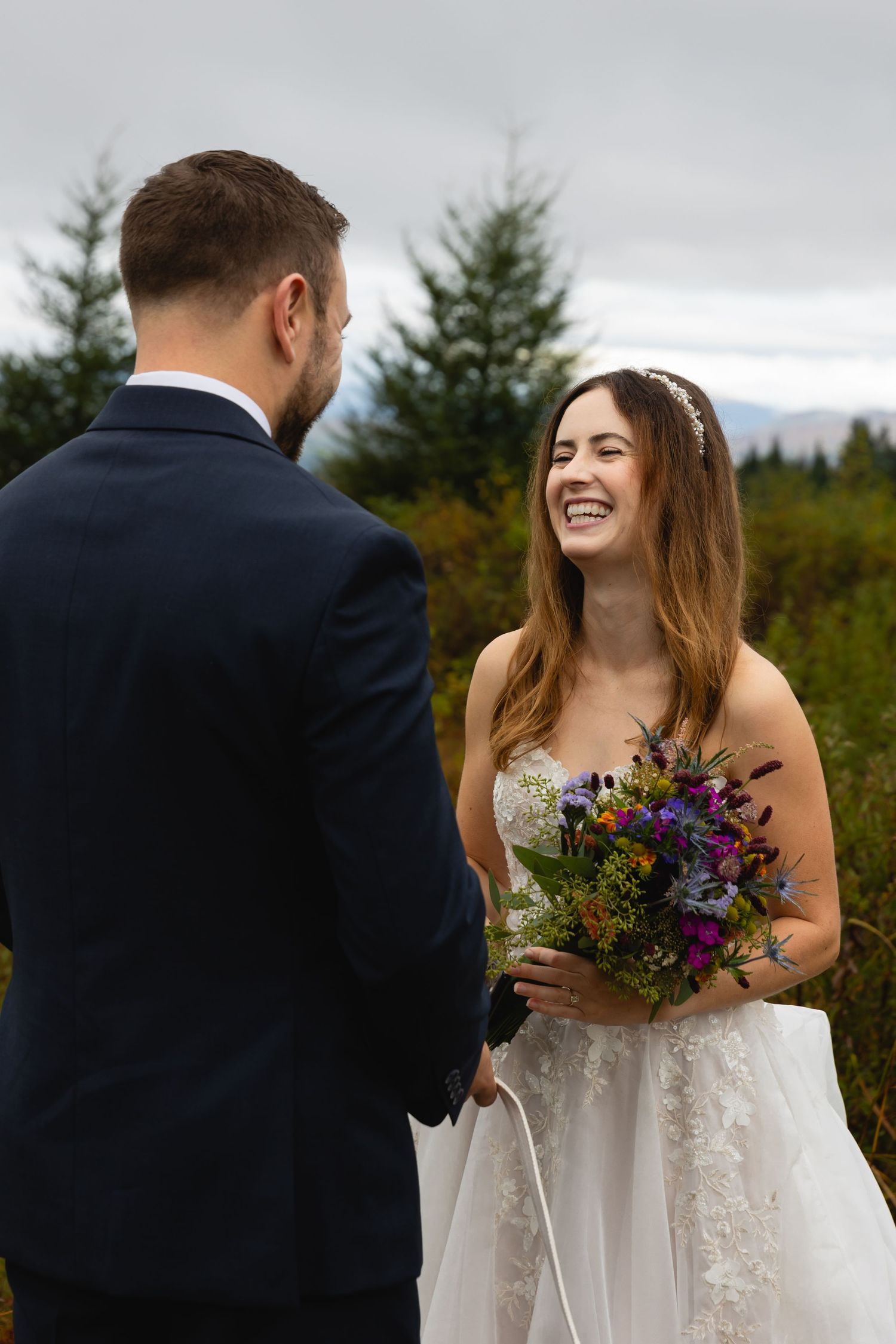A heartfelt moment shared between a couple during their outdoor wedding ceremony.