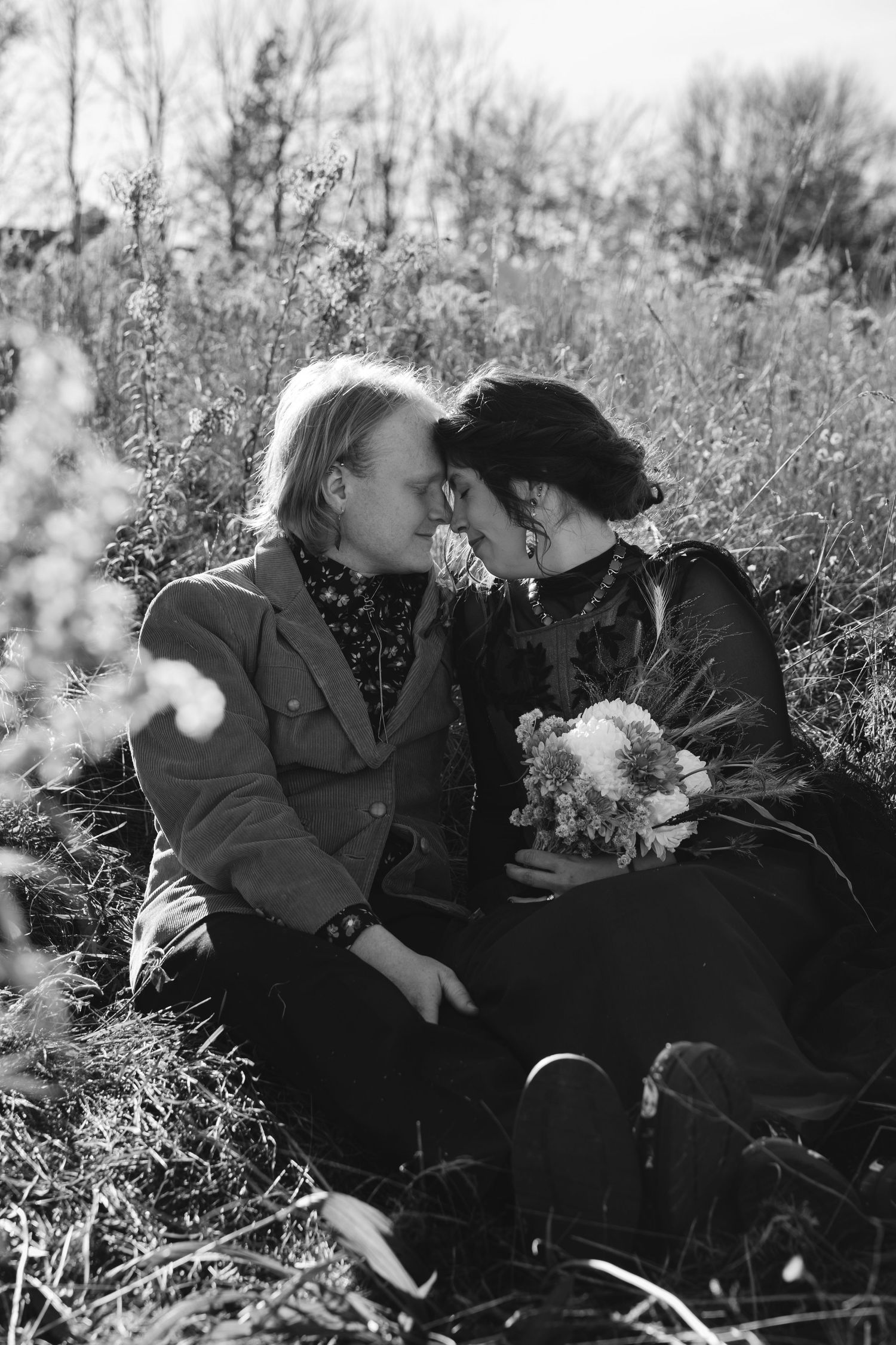 A romantic black and white sequence showing a couple embracing in a flowering meadow.