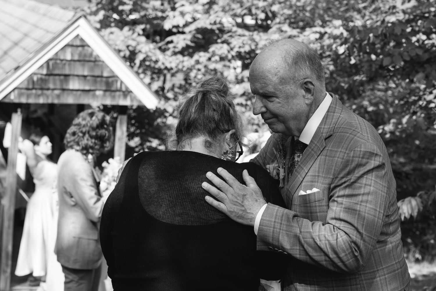 A black and white photo montage showing multiple wedding moments with couples embracing at outdoor ceremonies.