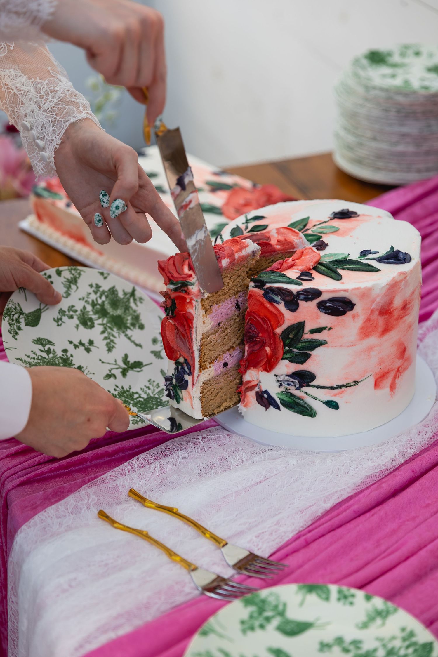 A series of photos showing someone cutting into a floral decorated cake with pink and green accents on a pink tablecloth.