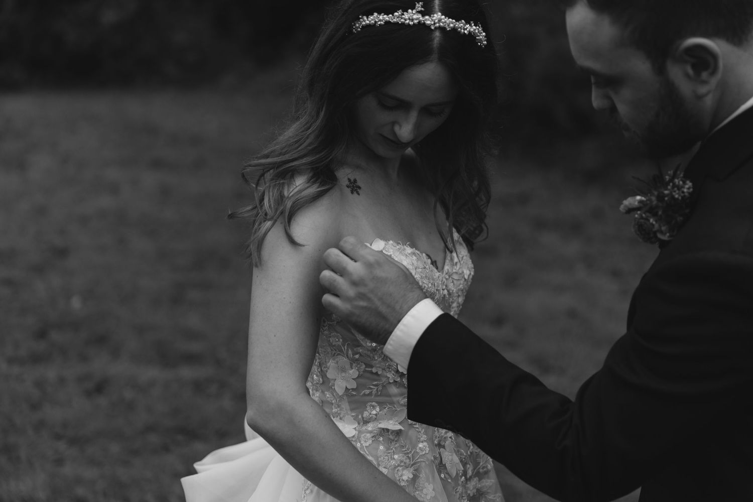 An intimate black and white wedding portrait captured in natural lighting.