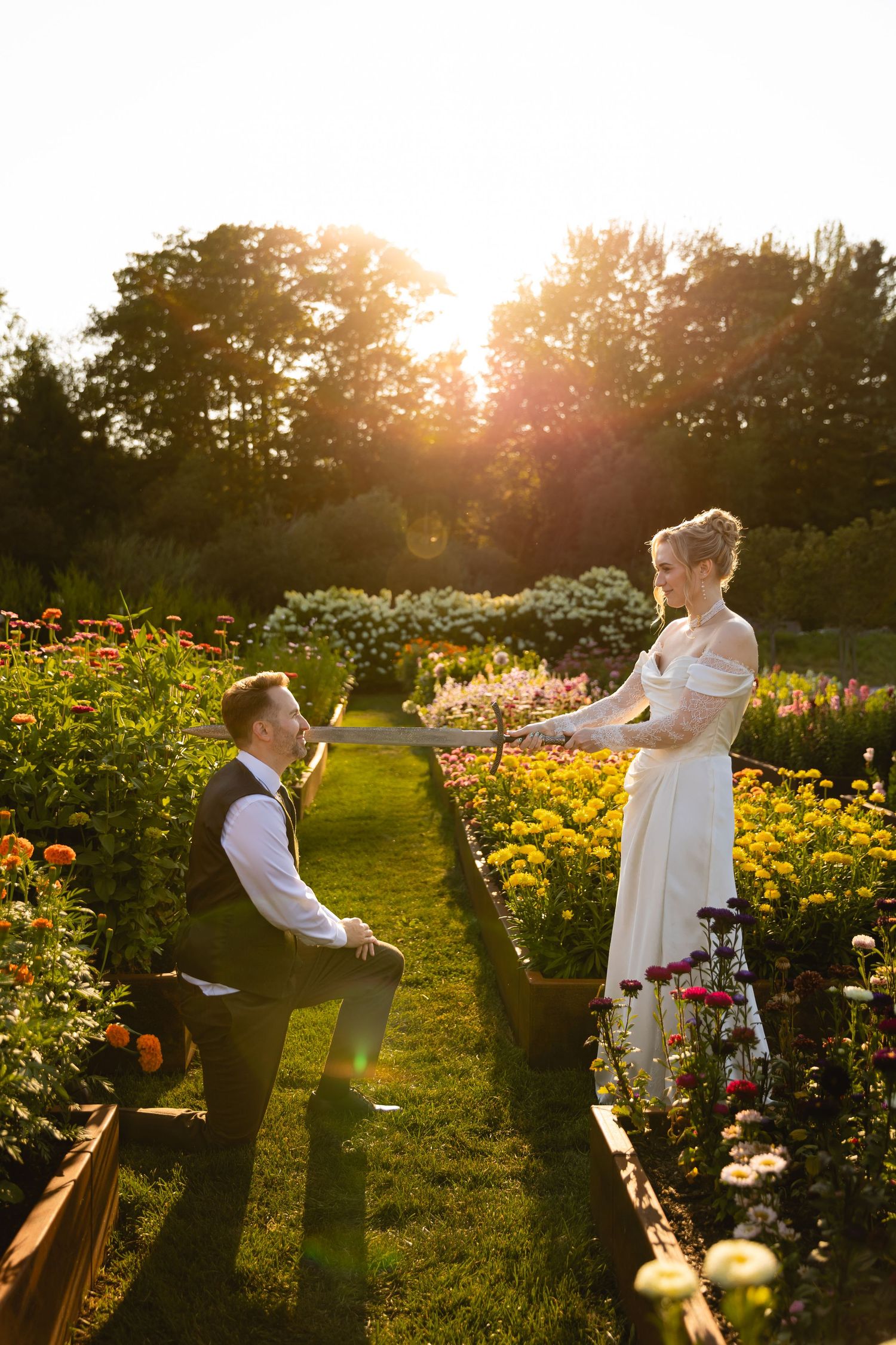 A romantic proposal scene at sunset in a blooming garden with orange flowers and golden sunlight streaming through trees.